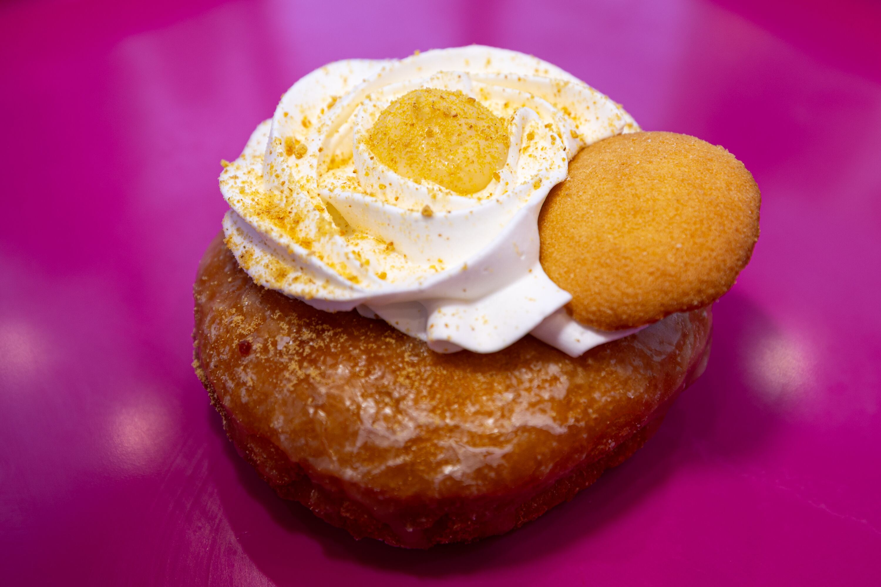 The Banana Puddin’ doughnut is displayed at the new Pinkbox Doughnuts located at 10235 State St. in Sandy on Sunday.