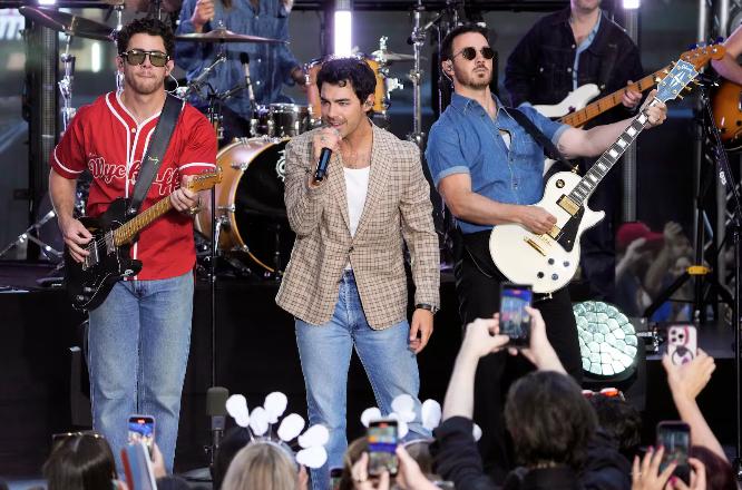 Nick Jonas, from left, Joe Jonas and Kevin Jonas from the Jonas Brothers perform on NBC's Today show at Rockefeller Plaza on Aug. 8, in New York.