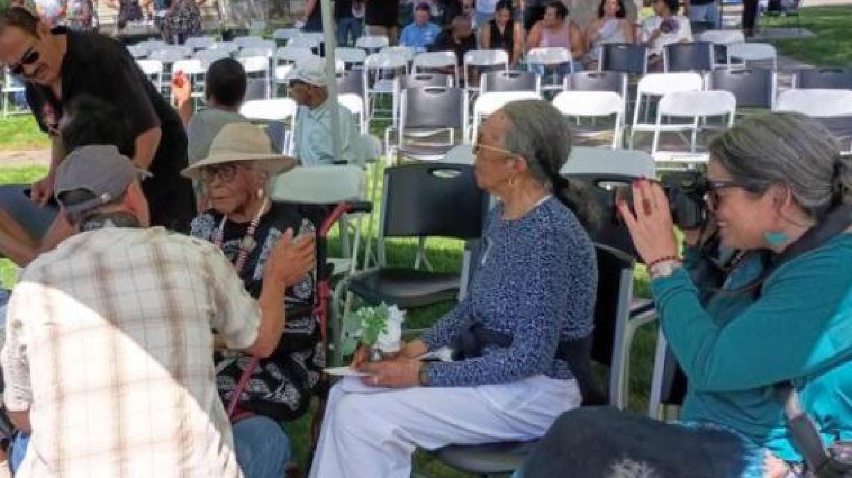 Lovely and spry at 100, Idaho Purce visits with friends and family during her centennial birthday celebration Sunday at Purce Park in Pocatello.