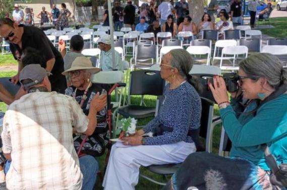 Lovely and spry at 100, Idaho Purce visits with friends and family during her centennial birthday celebration Sunday at Purce Park in Pocatello.