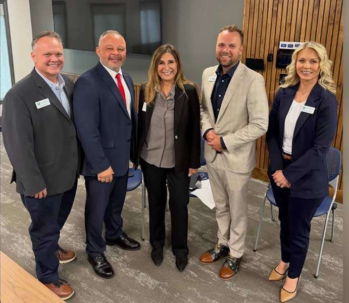 Stephanie Taylor-Thompson, right, with Jeremy Manwaring, left, Monty Burks, second from left, Victoria Seaman, center, and Brennan Summers, chief government affairs officer for the Idaho Dept. of Education, following Friday’s roundtable discussion in Idaho Falls.