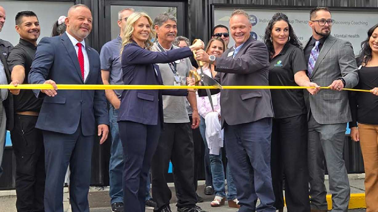 Stephanie Taylor-Thompson, center left, and her co-founder, Jeremy Manwaring, cut the ribbon on the new Cornerstone Wellness and Recovery Center at 522 Lomax in Idaho Falls.