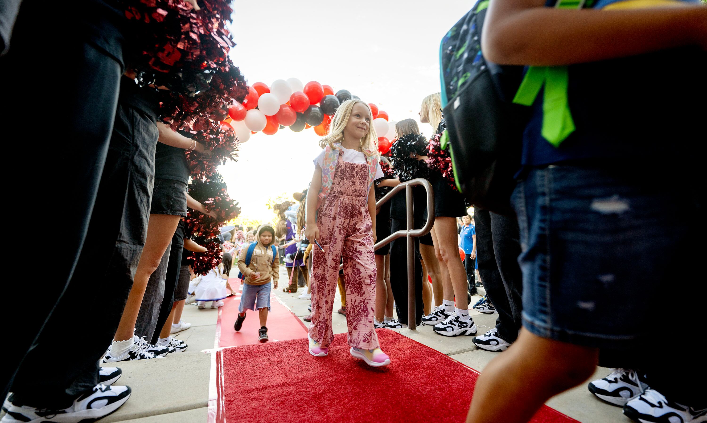 Sandy Elementary welcomes its students back to school with a celebratory atmosphere and a red-carpet walk on Monday.