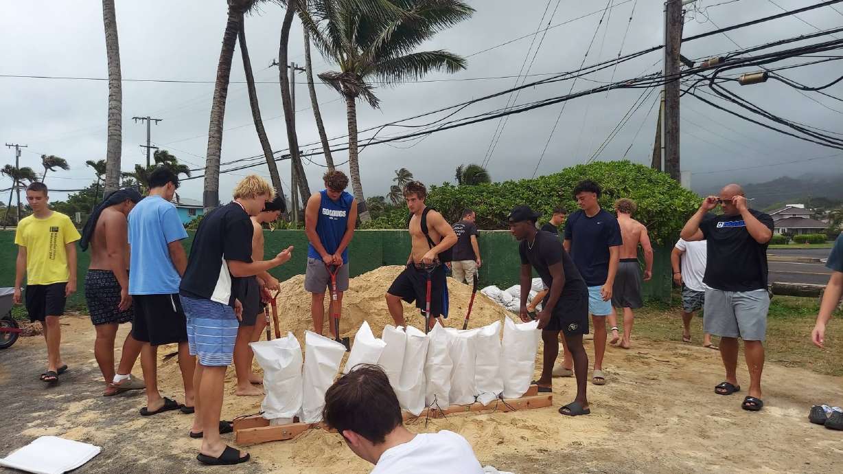 Members of the Orem High School football team help fill sandbags on Oahu's north shore ahead of Hurricane Lala. What began as a football trip to Hawaii turned into an unexpected opportunity for service when members of the Orem High School football team helped residents prepare for Hurricane Lala.