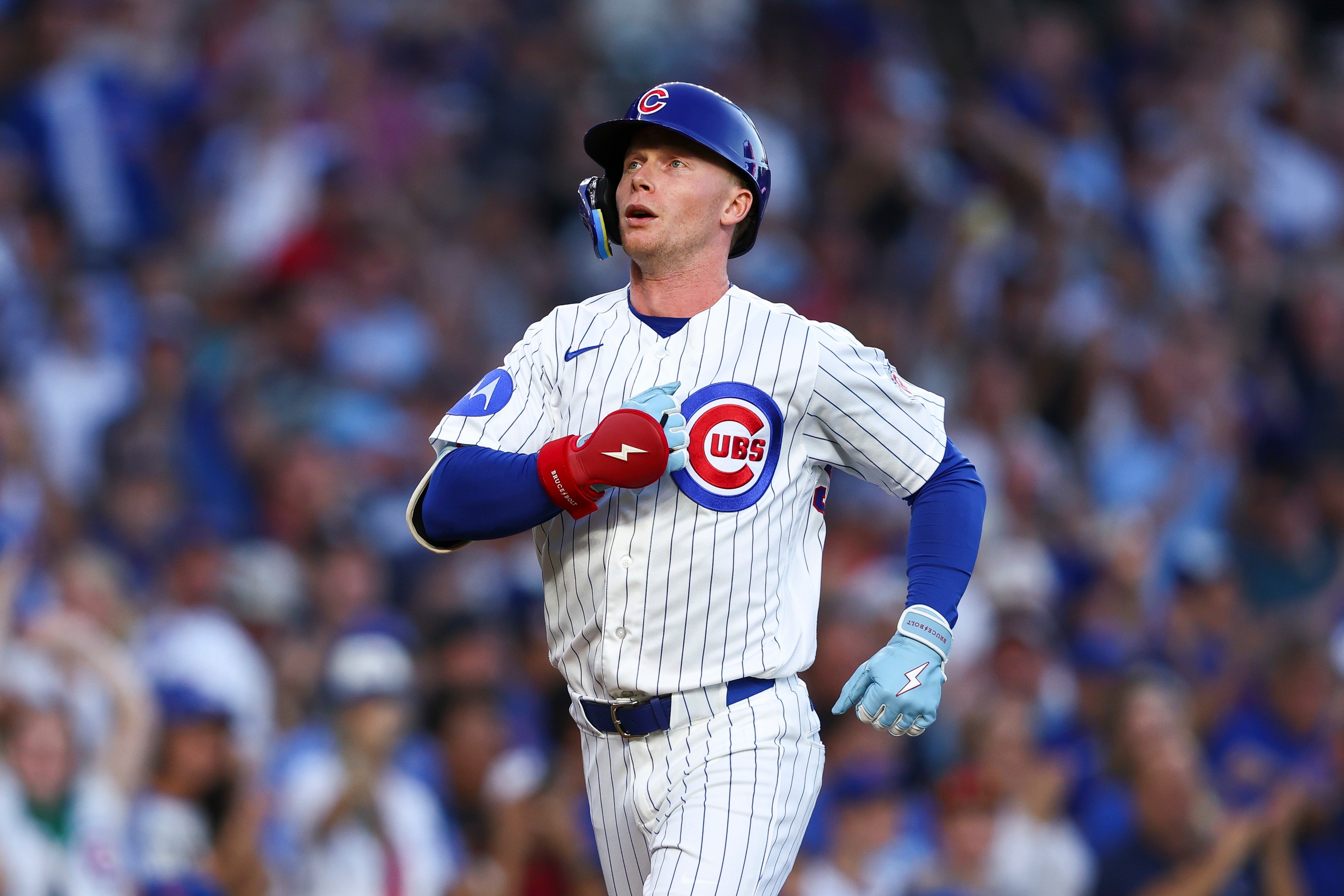 Chicago Cubs' Pete Crow-Armstrong gestures while reaching home plate after hitting a home run during the first inning of a baseball game against the Chicago White Sox in Chicago, Monday, Aug. 17, 2026. 