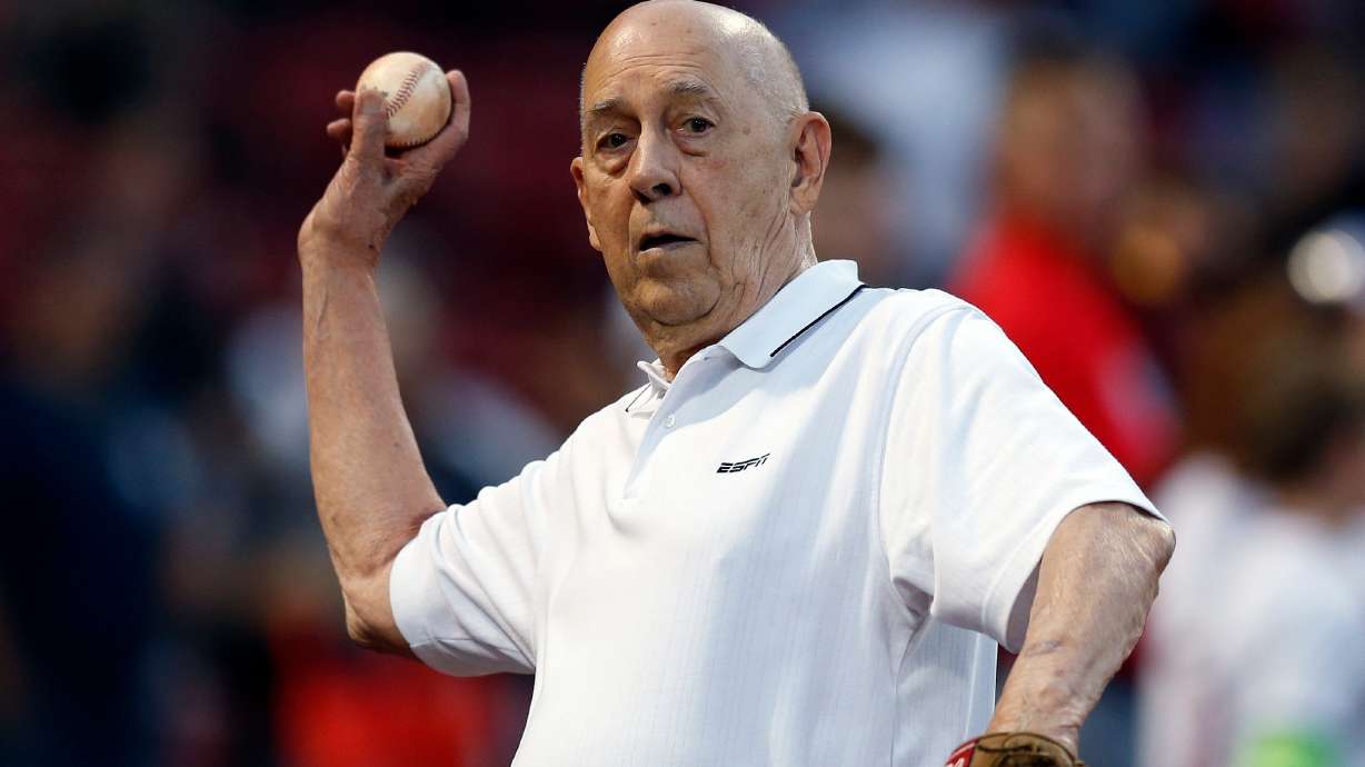 FILE - ESPN co-founder Bill Rasmussen tosses a ball before a baseball game between the Boston Red Sox and the New York Yankees in Boston, Sept. 8, 2019.