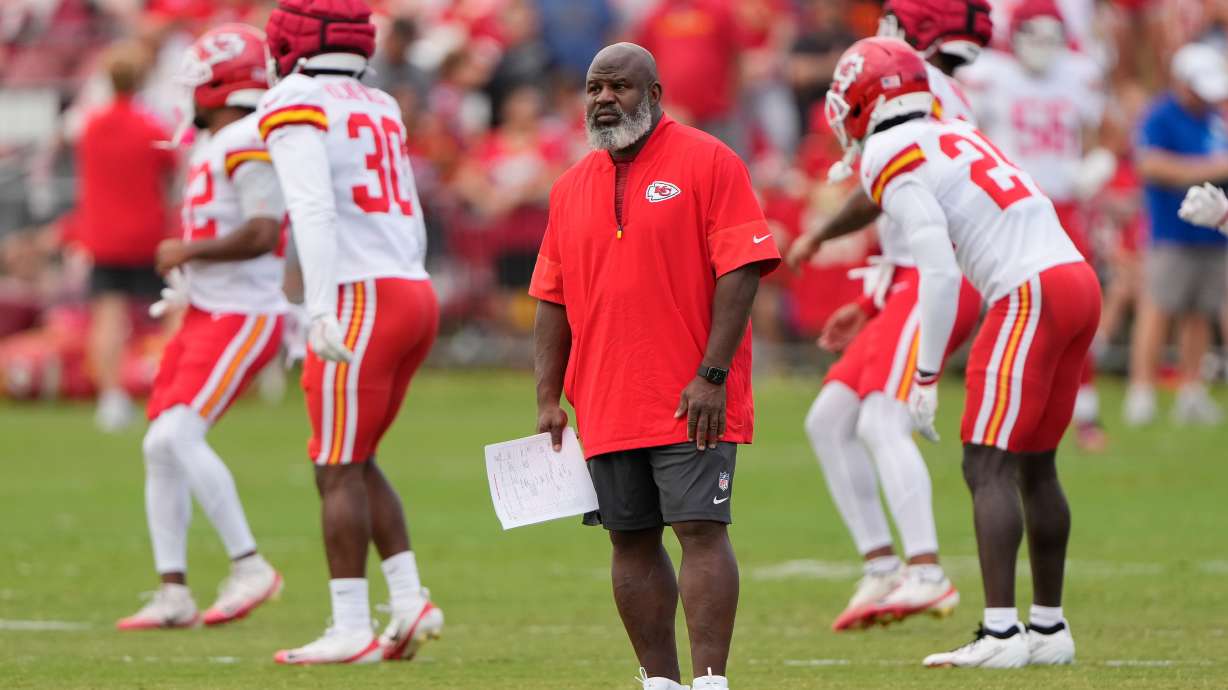 Kansas City Chiefs offensive coordinator Eric Bieniemy watches NFL football training camp Tuesday, Aug. 11, 2026, in St. Joseph, Mo.