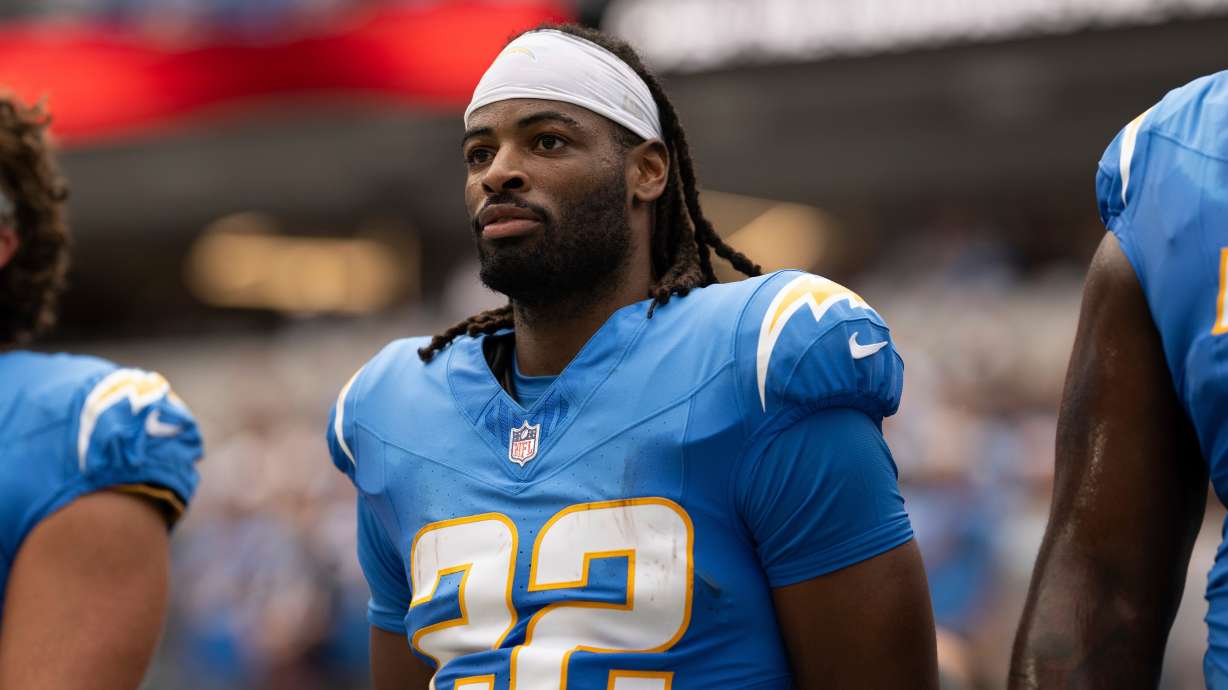 FILE - Los Angeles Chargers running back Najee Harris (22) stands for the National Anthem before an NFL football game against the Denver Broncos, Sept. 21, 2025, in Inglewood, Calif.