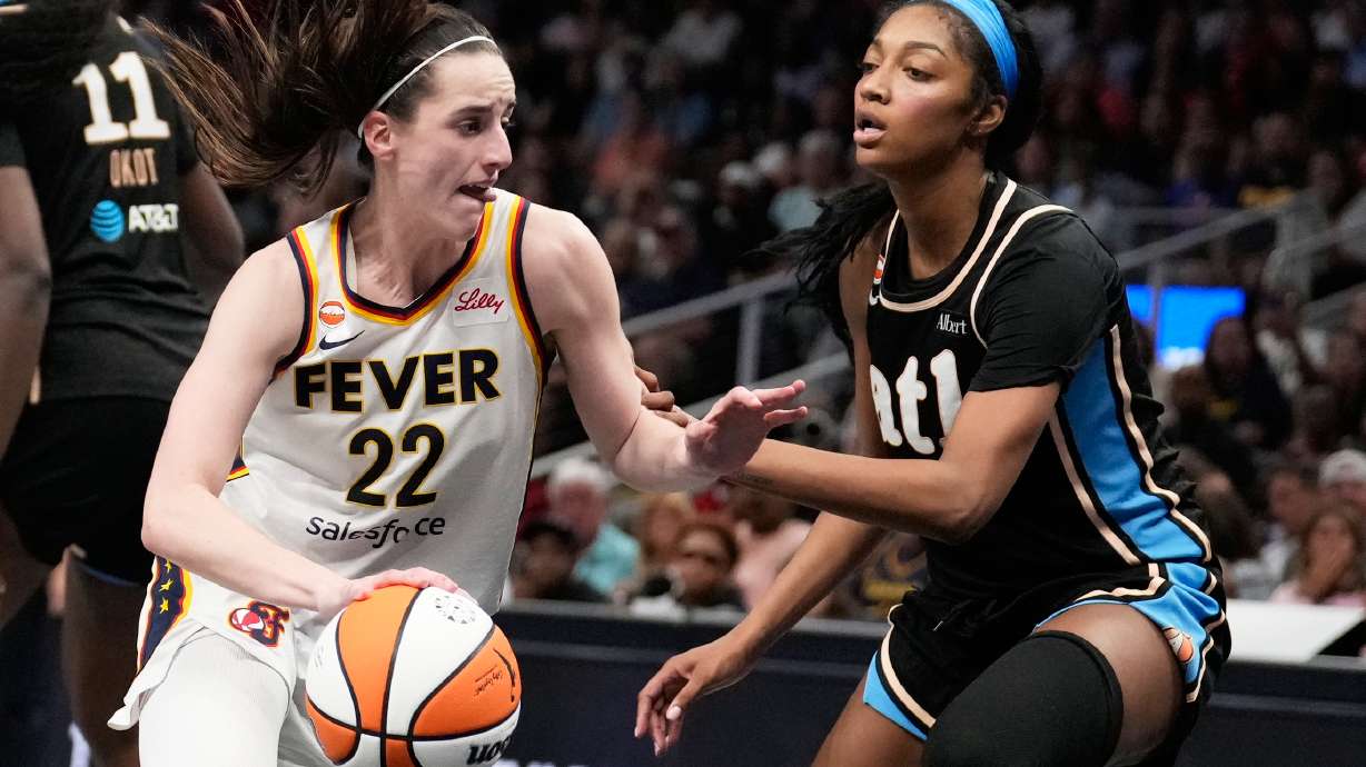 Indiana Fever's Caitlin Clark (22) dribbles the ball against Atlanta Dream forward Angel Reese (5) in the second half of an WNBA basketball game Sunday, Aug. 16, 2026, in Atlanta.