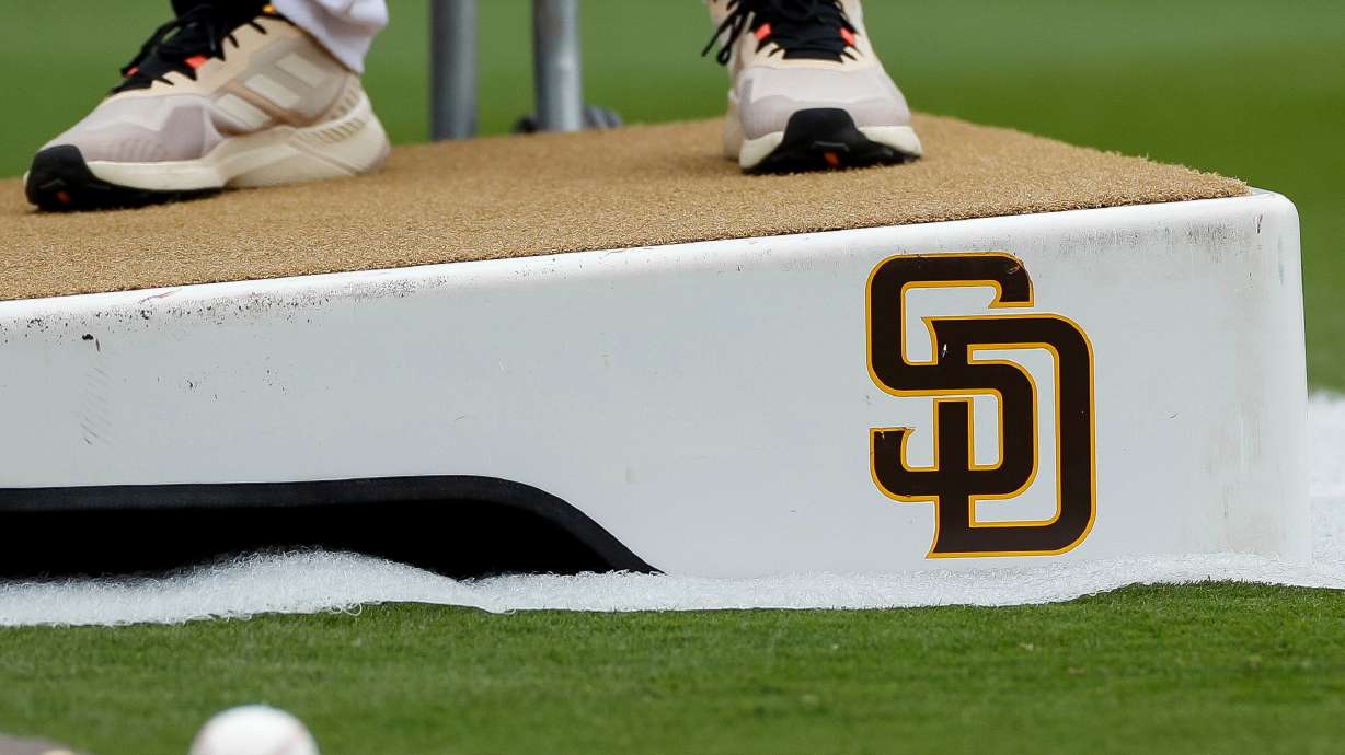 FILE - Detailed view of a San Diego Padres logo on a pitching mound during batting practice prior to a baseball game between the Padres and Boston Red Sox, May 20, 2023, in San Diego.