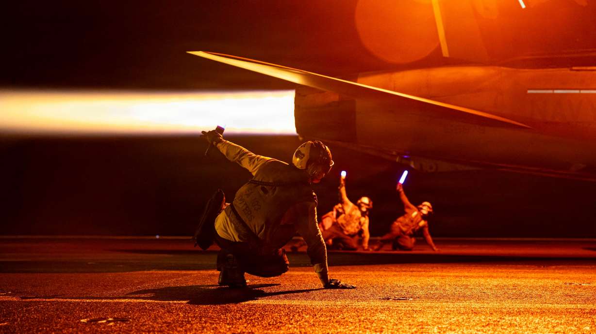 U.S. sailors conduct flight operations aboard Nimitz-class aircraft carrier USS George H.W. Bush on July 29. George H.W. Bush is deployed to the U.S. 5th Fleet area of operations to support maritime security and stability in the Middle East.