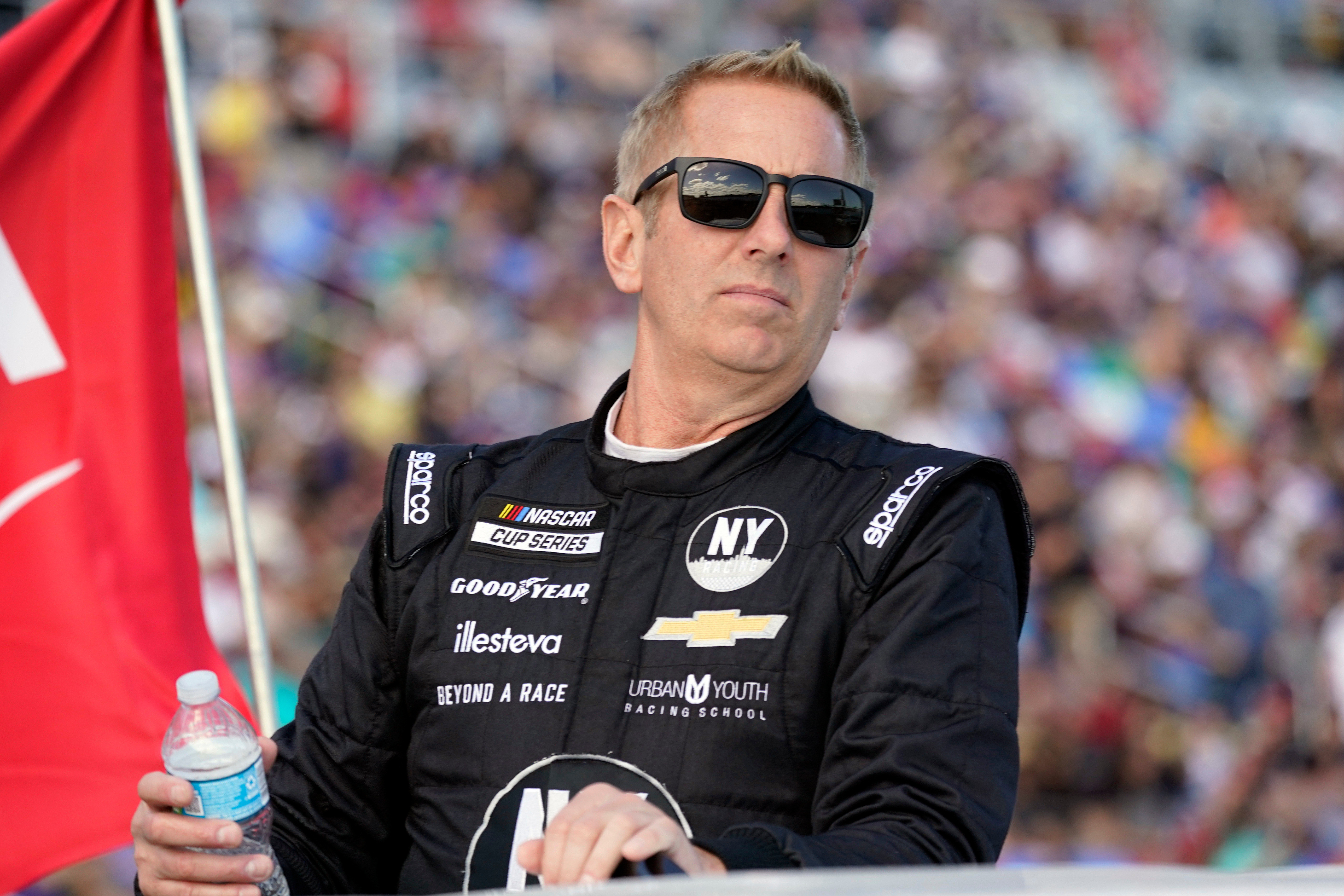 FILE - Greg Biffle looks on during driver introductions before the NASCAR Daytona 500 auto race at Daytona International Speedway, in Daytona Beach, Fla., Feb. 20, 2022. 