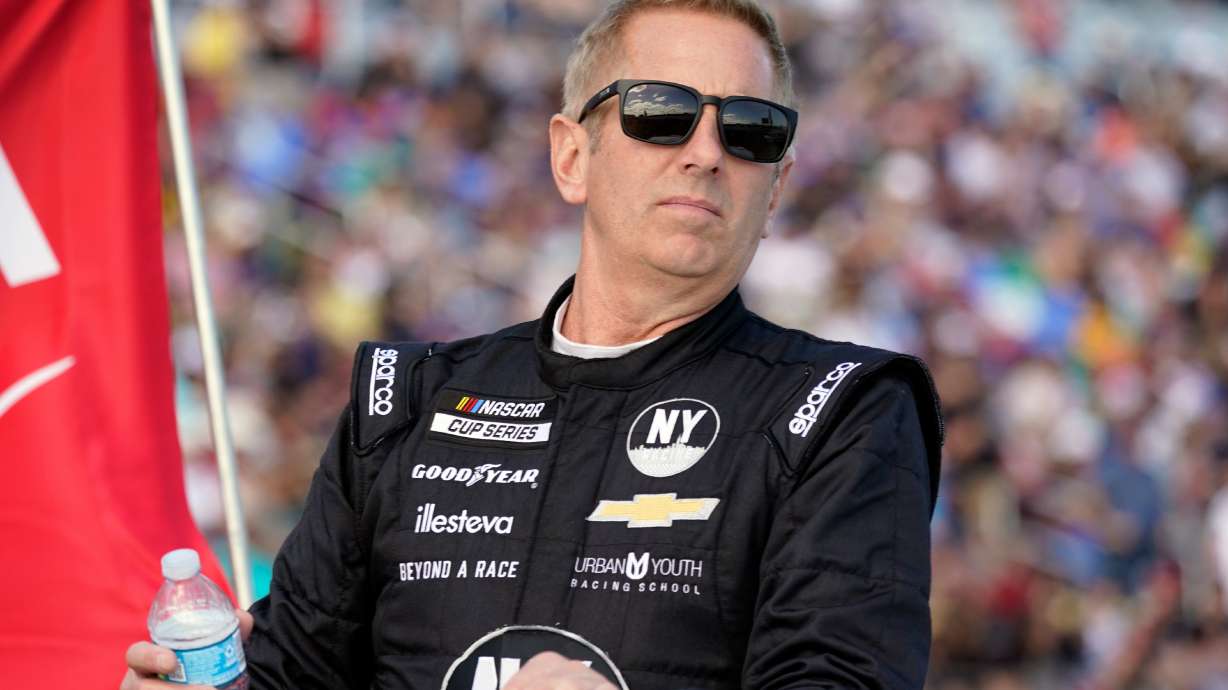 FILE - Greg Biffle looks on during driver introductions before the NASCAR Daytona 500 auto race at Daytona International Speedway, in Daytona Beach, Fla., Feb. 20, 2022.