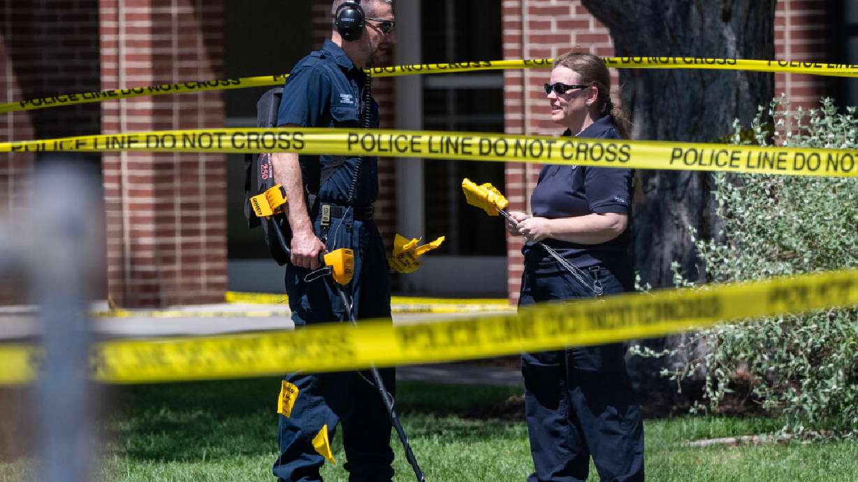Members of the Forensics Unit use a metal detector to search for evidence as police investigate a shooting that occurred in Kearns during a funeral on Monday. Leaders at the National Tongan American Society are reacting following the shooting.