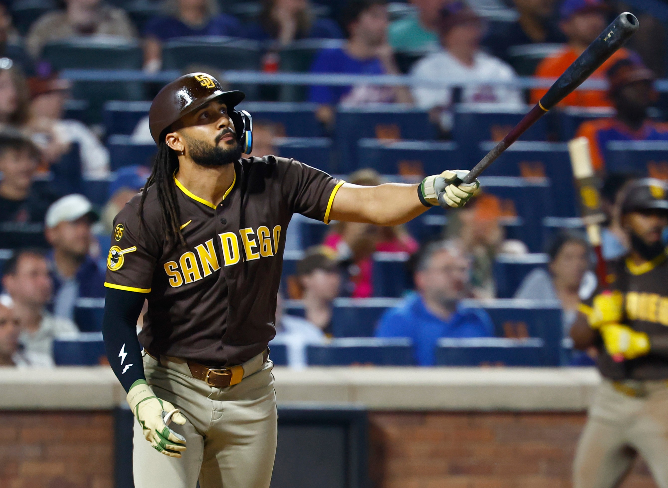 San Diego Padres' Fernando Tatis Jr. follows through on a two run home run against the New York Mets during the fifth inning of a baseball game, Tuesday, Aug. 18, 2026, in New York. 