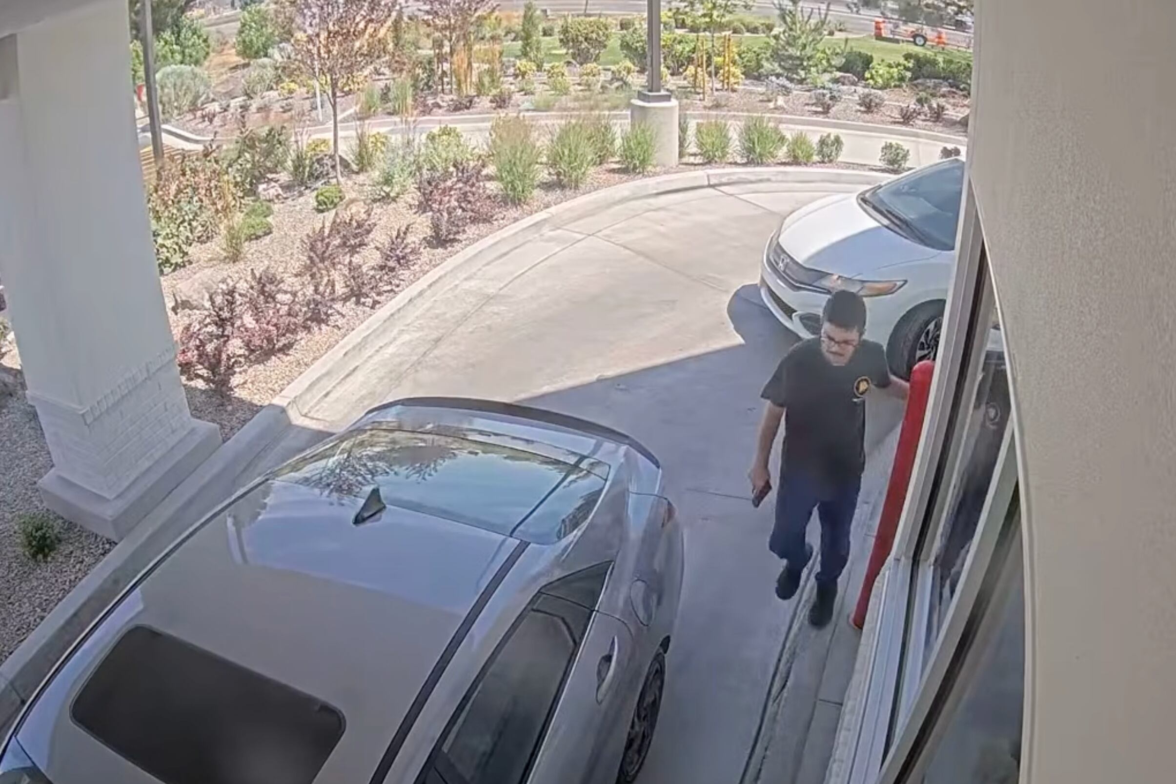 Chad Williams holding a gun and approaching a car in an In-N-Out drive-thru, Aug. 1, in Twin Falls, Idaho. James Keith of ALERRT emphasized law enforcement has priority to end an active shooter threat.