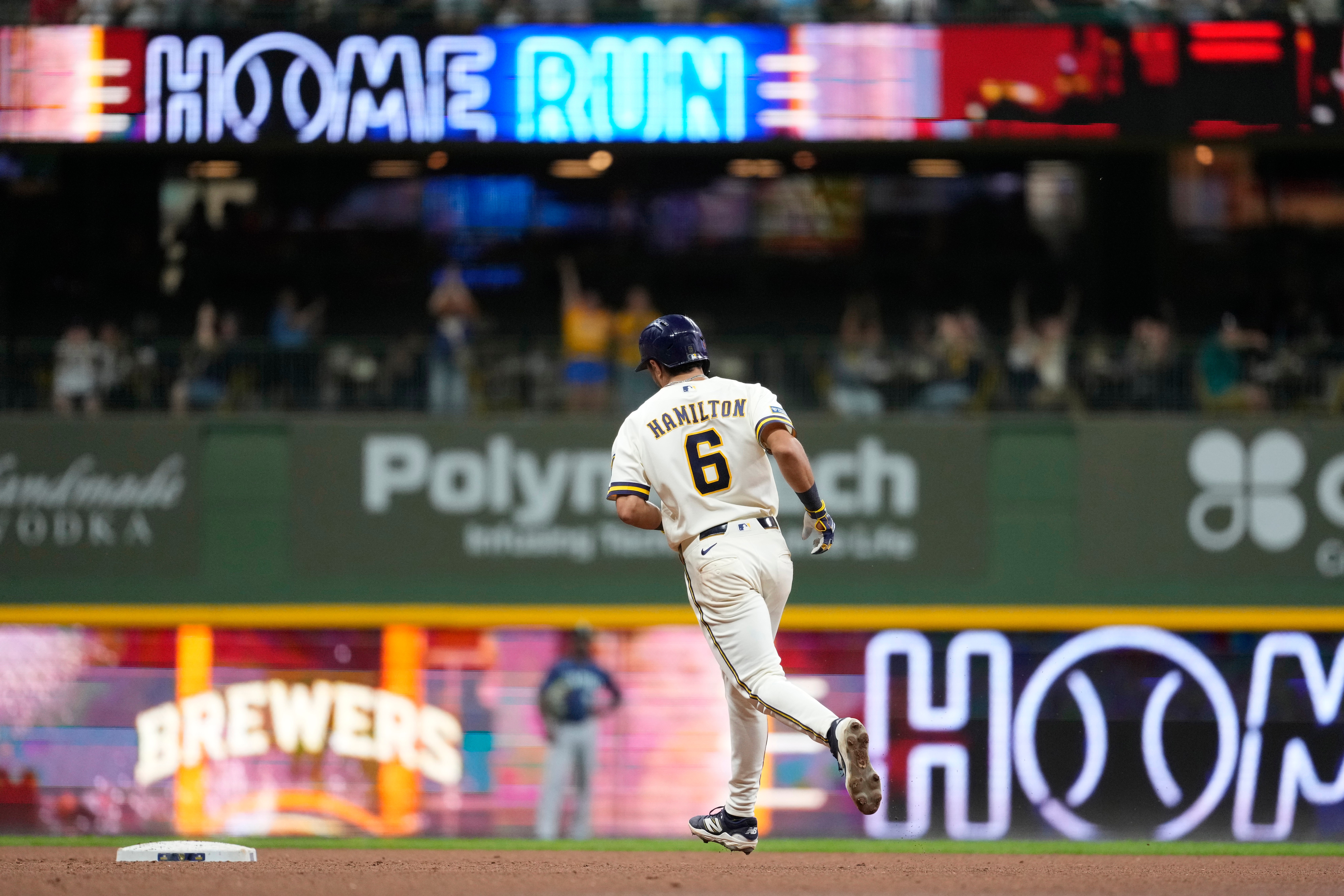 Milwaukee Brewers' David Hamilton rounds the bases after hitting a three-run home run during the sixth inning of a baseball game against the Seattle Mariners, Tuesday, Aug. 18, 2026, in Milwaukee. 