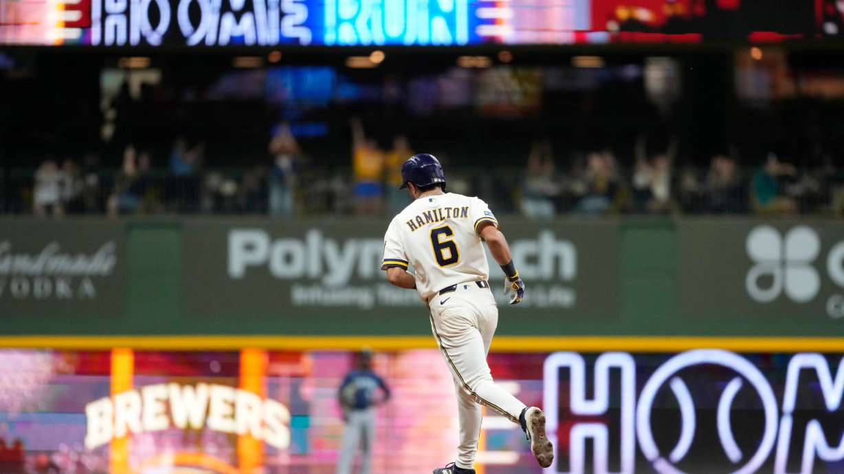 Milwaukee Brewers' David Hamilton rounds the bases after hitting a three-run home run during the sixth inning of a baseball game against the Seattle Mariners, Tuesday, Aug. 18, 2026, in Milwaukee.