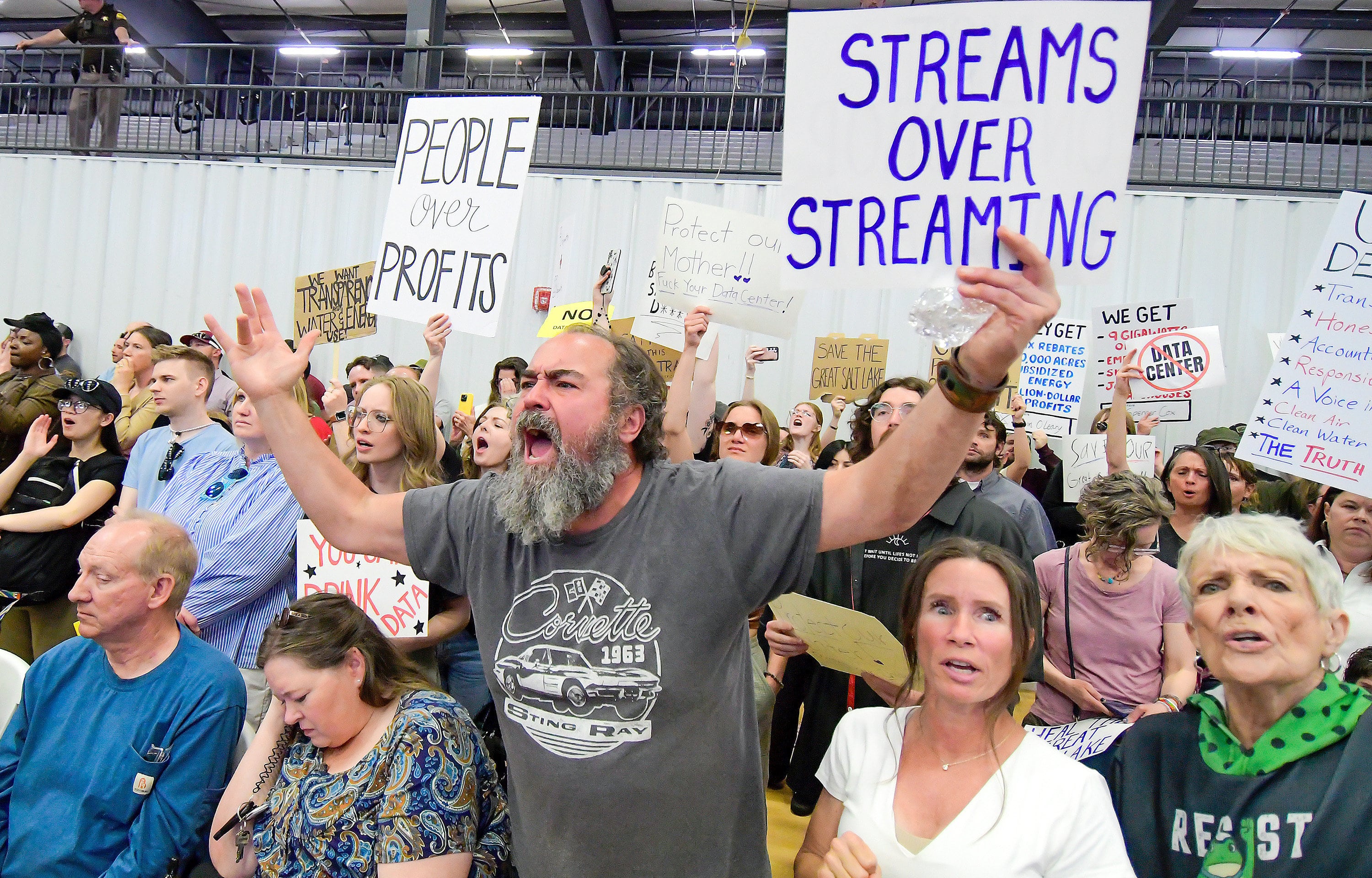 Michael Smith, center, and others yell after Box Elder County Commissioners approved a data center during a meeting on May 4, 2026, in Tremonton.
