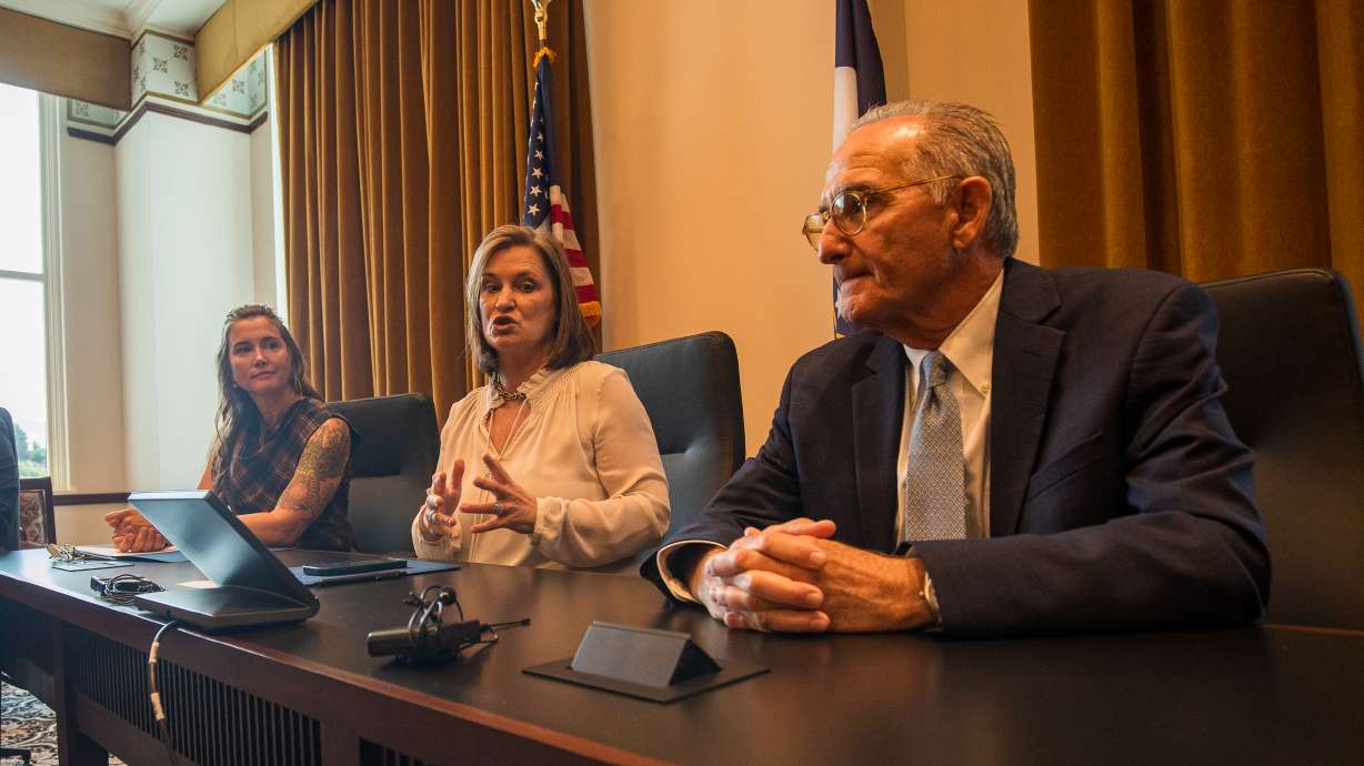 Salt Lake County Mayor Jenny Wilson, center, speaks about the county's new behavioral health and justice project at the Utah Capitol North Conference Center on Tuesday. She's seated next to Salt Lake City Mayor Erin Mendenhall, left, and former Miami judge Steve Leifman, right.