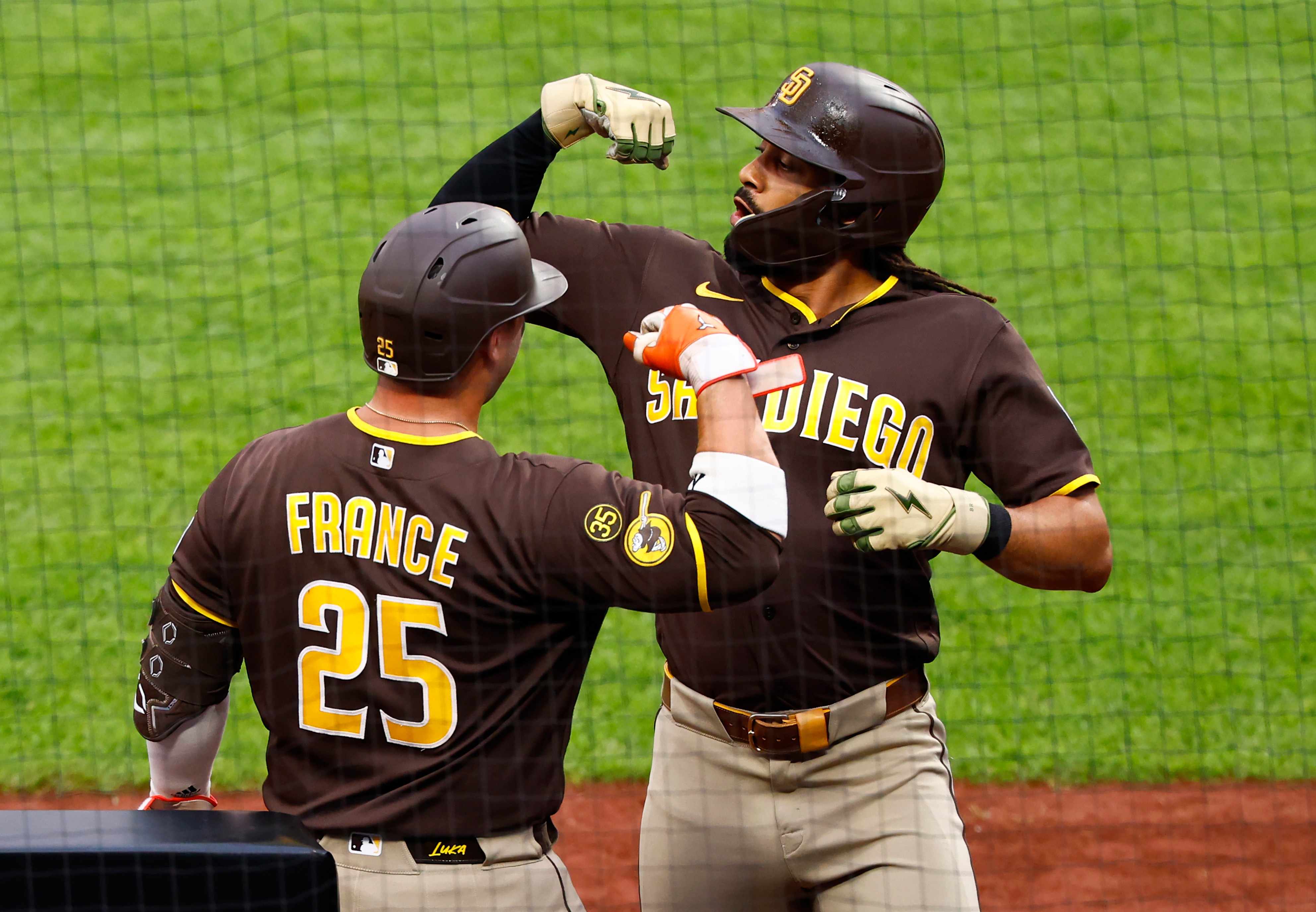 San Diego Padres' Fernando Tatis Jr. celebrates with Ty France (25) after hitting a home run against the New York Mets during the first inning of a baseball game, Tuesday, Aug. 18, 2026, in New York. 