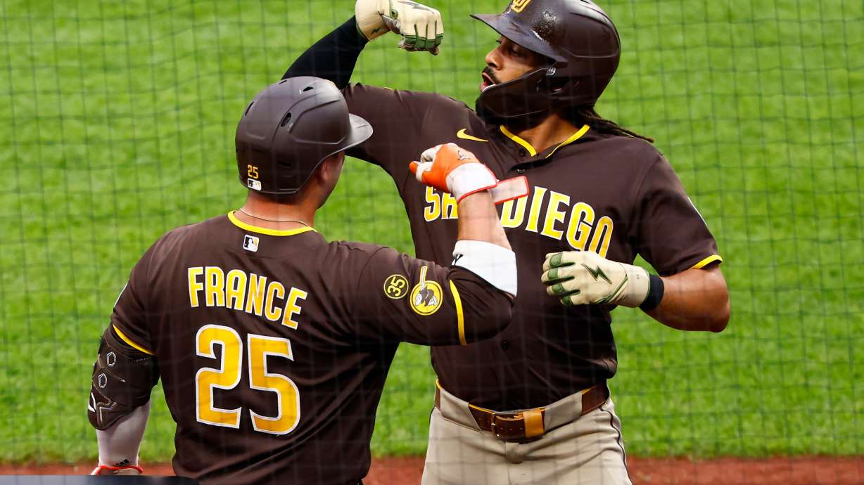 San Diego Padres' Fernando Tatis Jr. celebrates with Ty France (25) after hitting a home run against the New York Mets during the first inning of a baseball game, Tuesday, Aug. 18, 2026, in New York.
