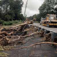 Former teacher, 93, among the deaths blamed on storm as Hawaii residents struggle to clean up