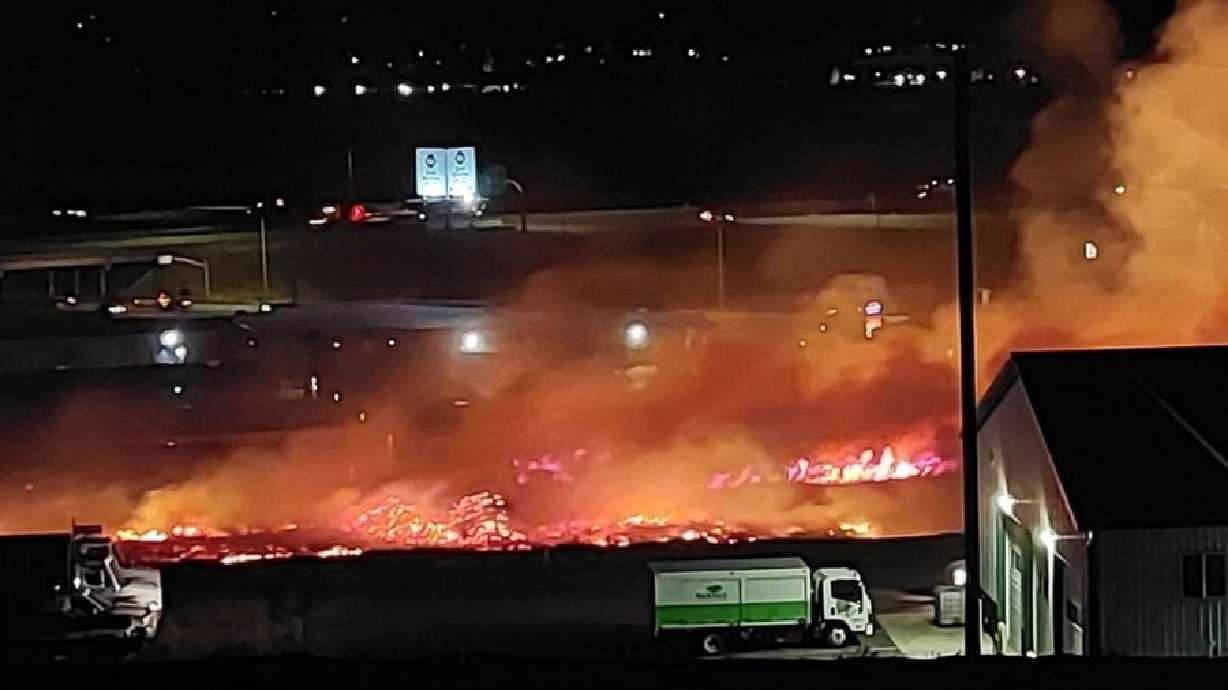 Flames and smoke rise up from the Dugway Fire located near the mouth of Weber Canyon on Wednesday.