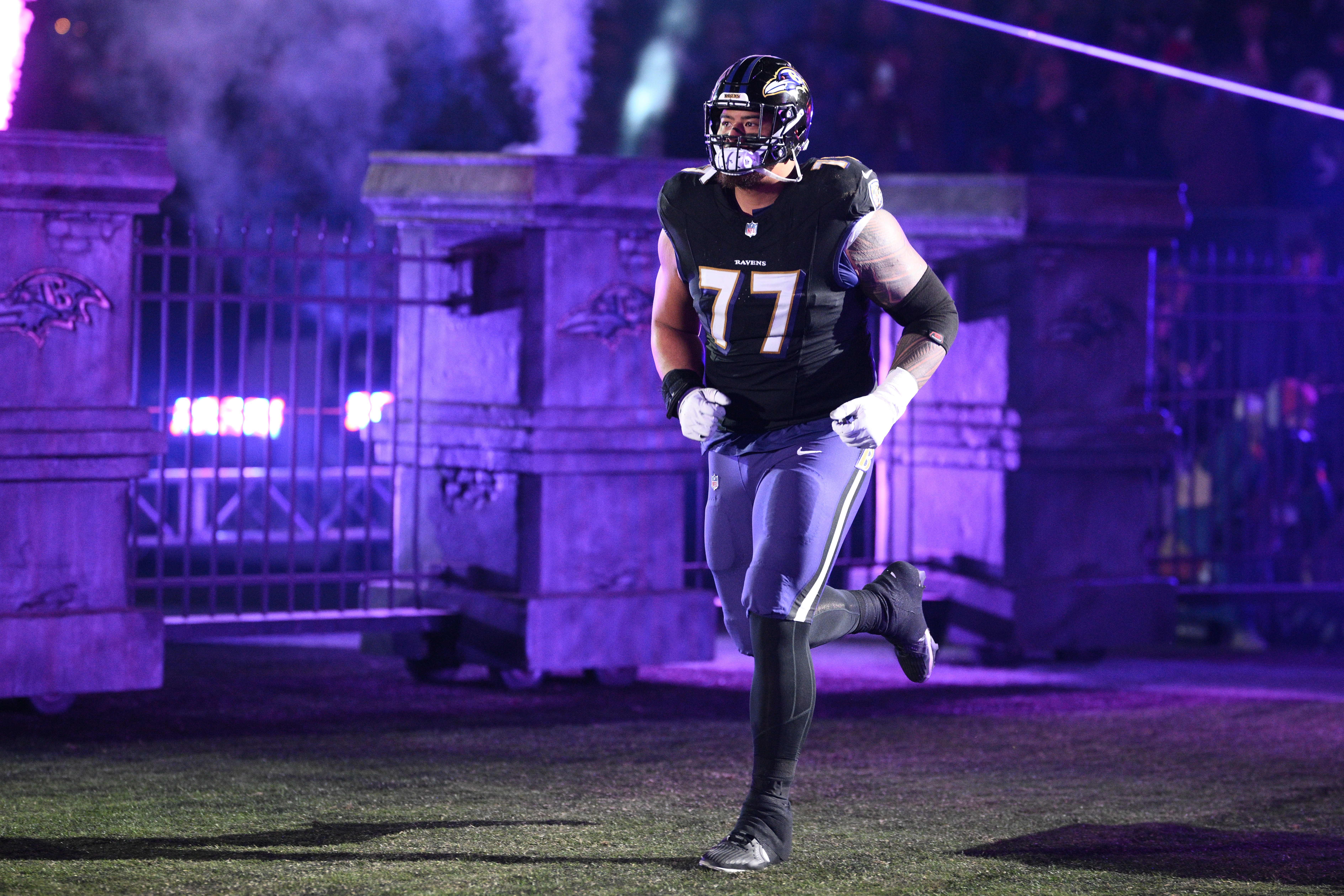 FILE - Baltimore Ravens guard Daniel Faalele (77) takes to the field before an NFL football game against the New England Patriots, Sunday, Dec. 21, 2025, in Baltimore. 