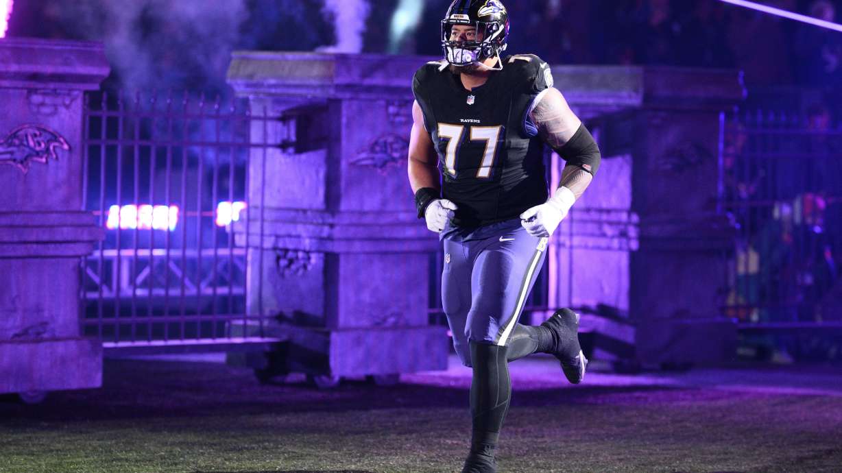 FILE - Baltimore Ravens guard Daniel Faalele (77) takes to the field before an NFL football game against the New England Patriots, Sunday, Dec. 21, 2025, in Baltimore.