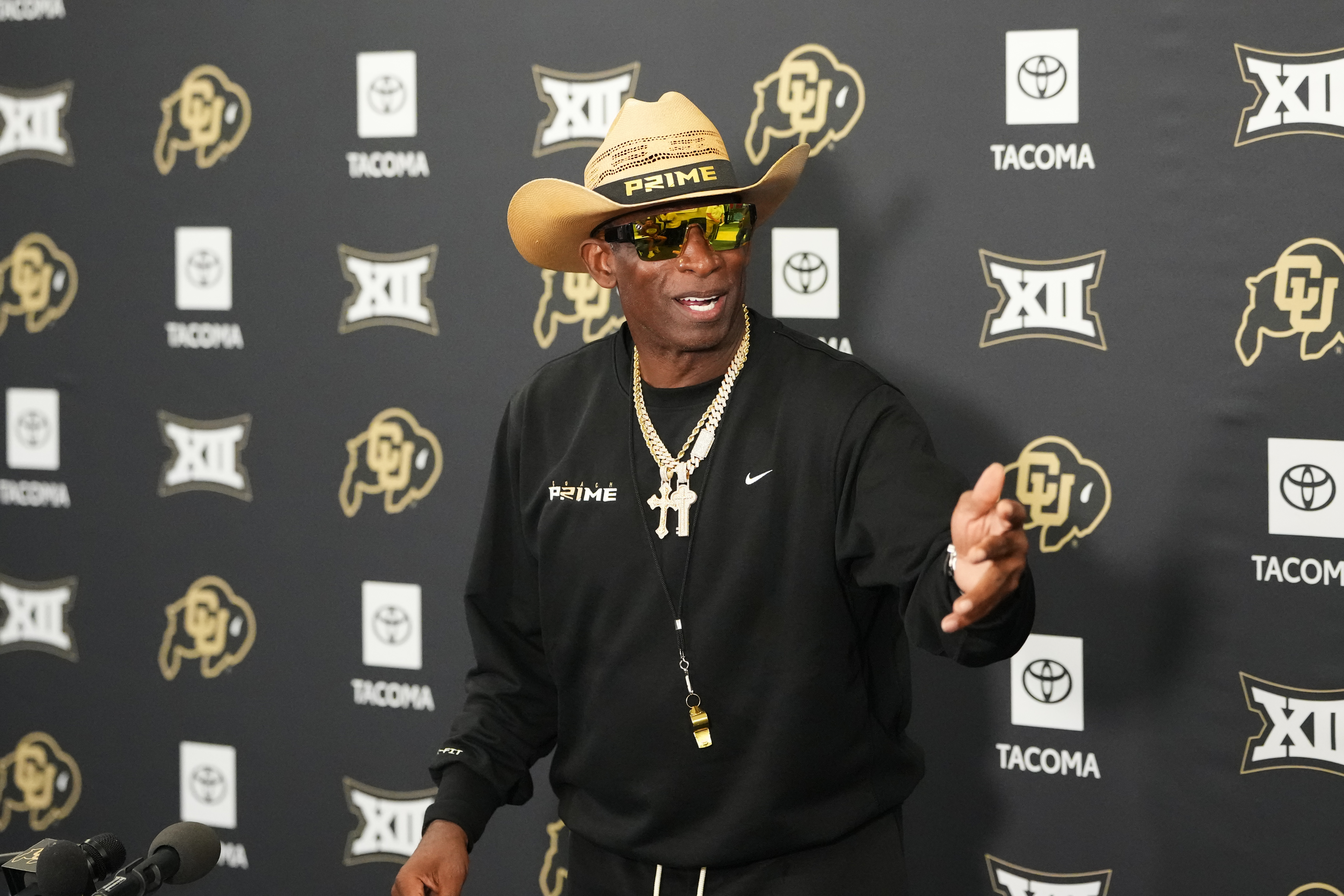 Colorado head coach Deion Sanders talks to reporters after practice at an NCAA college football training camp in Fountain, Colo., Thursday, Aug. 6, 2026. 