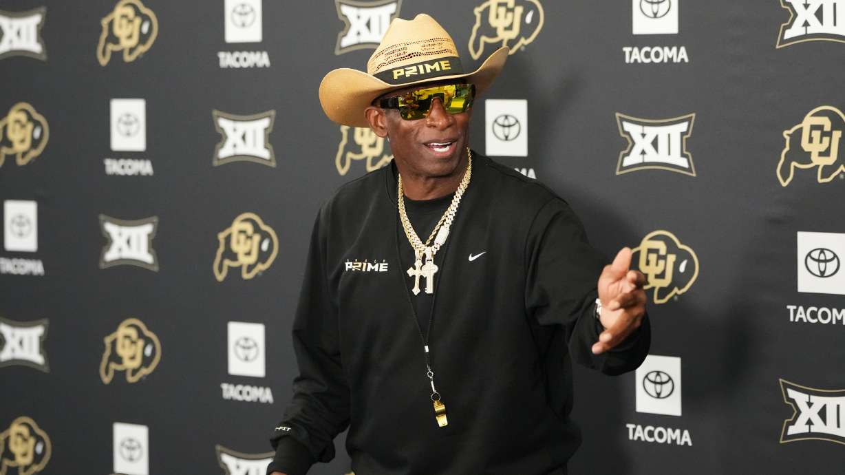 Colorado head coach Deion Sanders talks to reporters after practice at an NCAA college football training camp in Fountain, Colo., Thursday, Aug. 6, 2026.