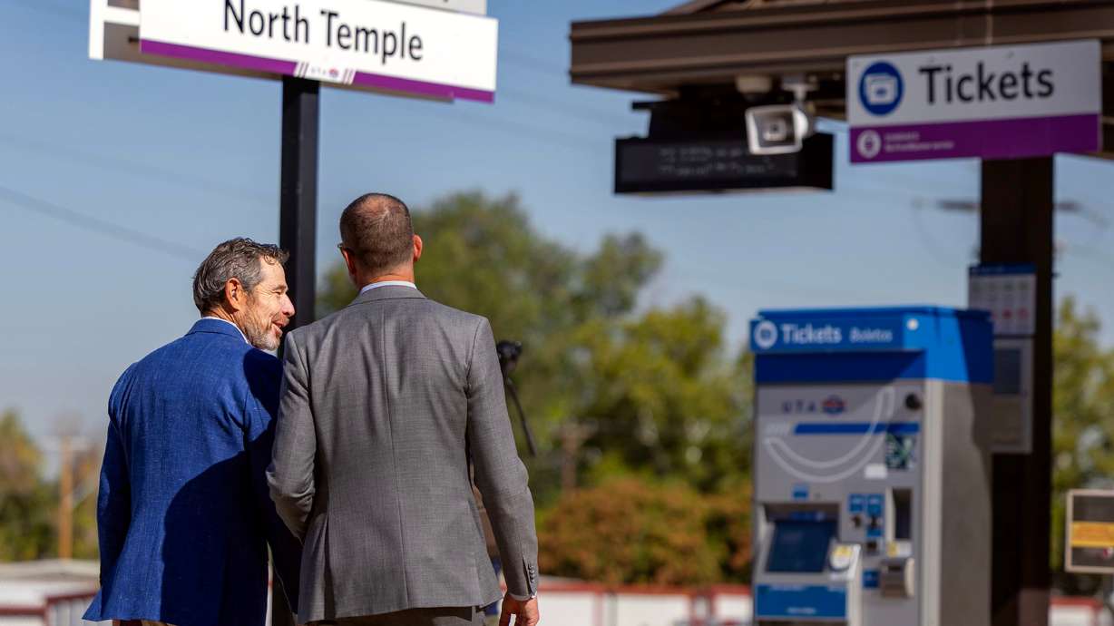 Sen. John Curtis, left, and Andrew Gruber, executive director of Wasatch Front Regional Council, walk to a TRAX platform during a meeting with leaders from Utah Transit Authority and the Wasatch Front Regional Council in Salt Lake City on Wednesday.