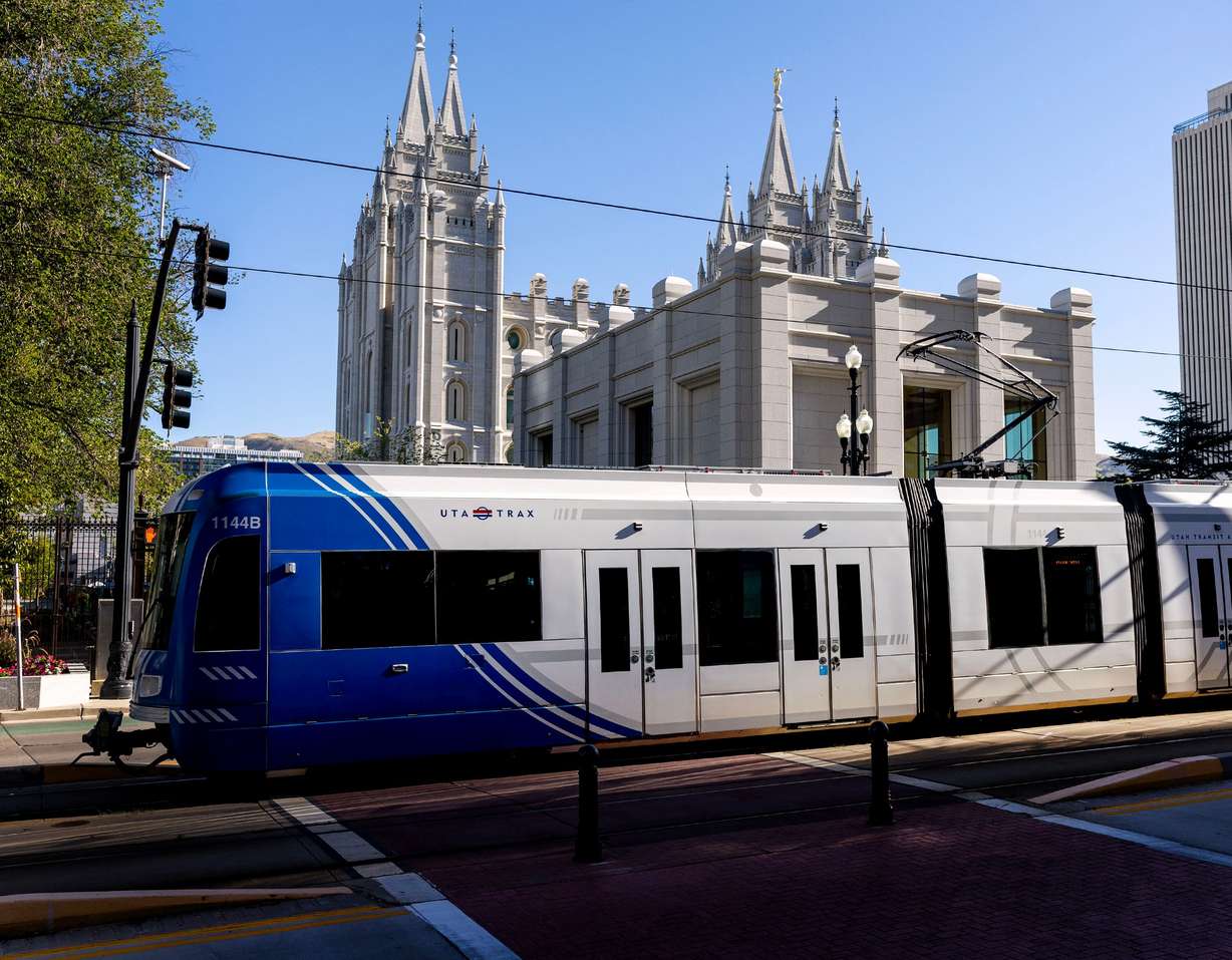 A TRAX train moves past Temple Square in Salt Lake City on Wednesday.