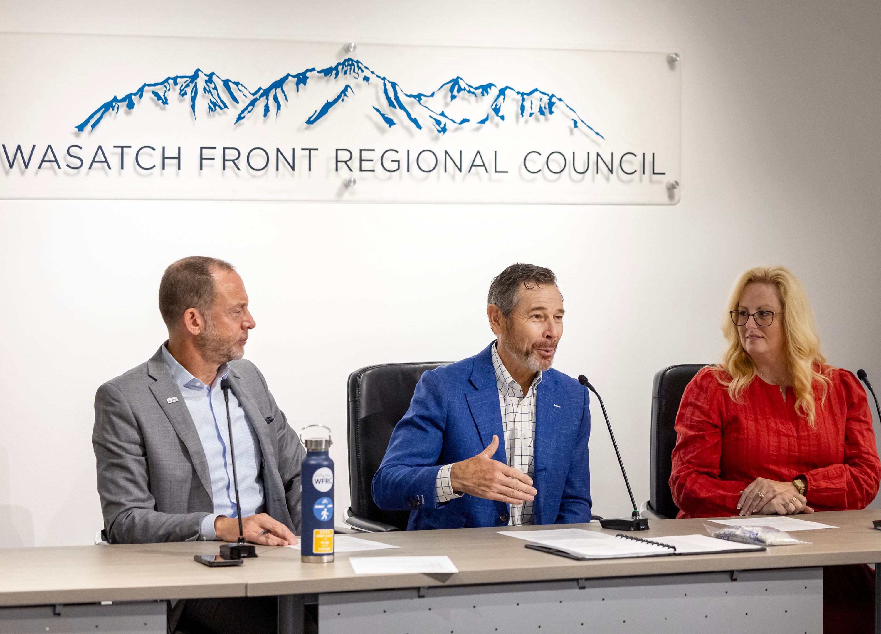 Andrew Gruber, executive director of Wasatch Front Regional Council, left, Sen. John Curtis, and Dawn Ramsey, chair of the Wasatch Front Regional Council and the mayor of South Jordan, speak during a meeting with leaders from Utah Transit Authority and WFRC in Salt Lake City on Wednesday.