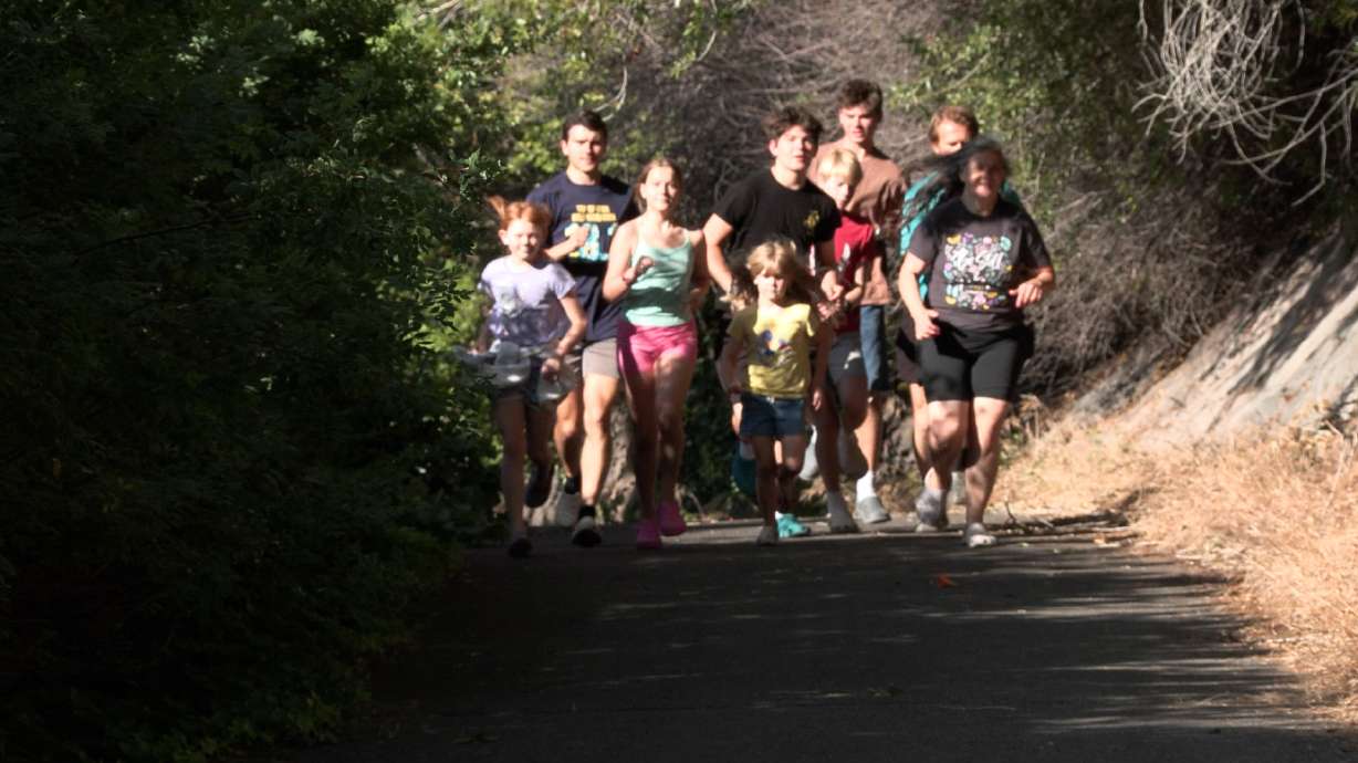 The Pachevs out for a run on July 2. Sarah and Sasha Pachev joke that they've got a family farm. But they're not growing corn or raising livestock. They're raising runners.