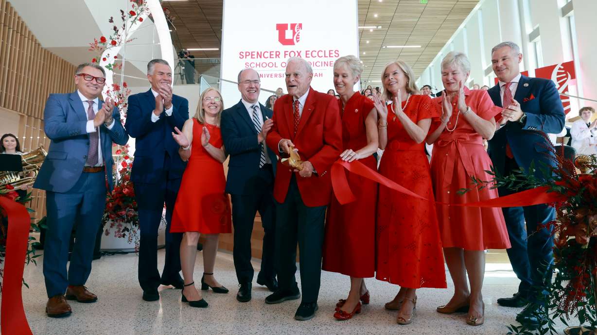 Spencer Fox Eccles, chairman and CEO of the George S. and Dolores Doré Eccles Foundation and the Nora Eccles Treadwell Foundation, cuts the ceremonial ribbon during the dedication for the new Spencer Fox Eccles School of Medicine at the University of Utah in Salt Lake City on Wednesday.