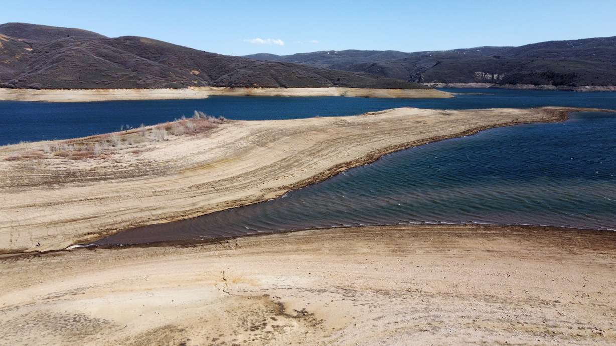 Very low water levels at Jordanelle Reservoir in Wasatch County are pictured after Gov. Spencer Cox and Lt. Governor Deidre Henderson ceremonially signed key water legislation on Monday, April 18, 2022.