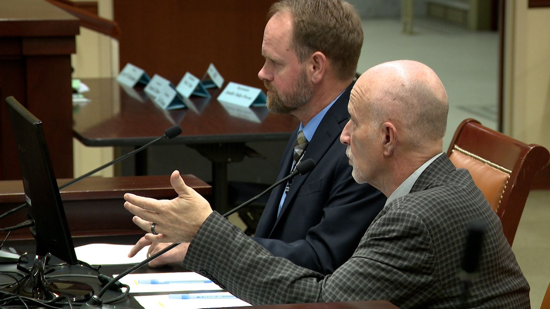 Utah State Hospital assistant superintendent Jeremy Christensen, left, and superintendent Dallas Earnshaw, right, speak to members of the Health and Human Services Interim Committee on Wednesday.