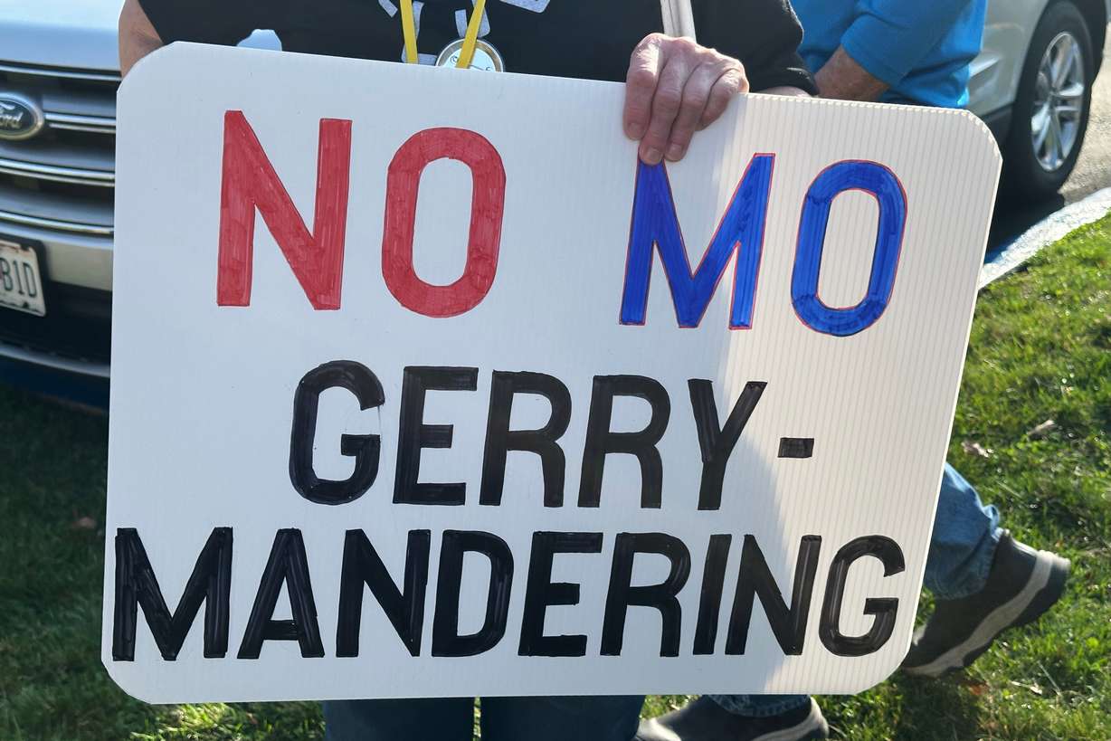 A person holds a sign opposing the new U.S. House districts passed by the Missouri General Assembly during a protest outside the state Capitol, in Jefferson City, Mo., March 10. The map was unanimously rejected by the state Supreme Court on Thursday.