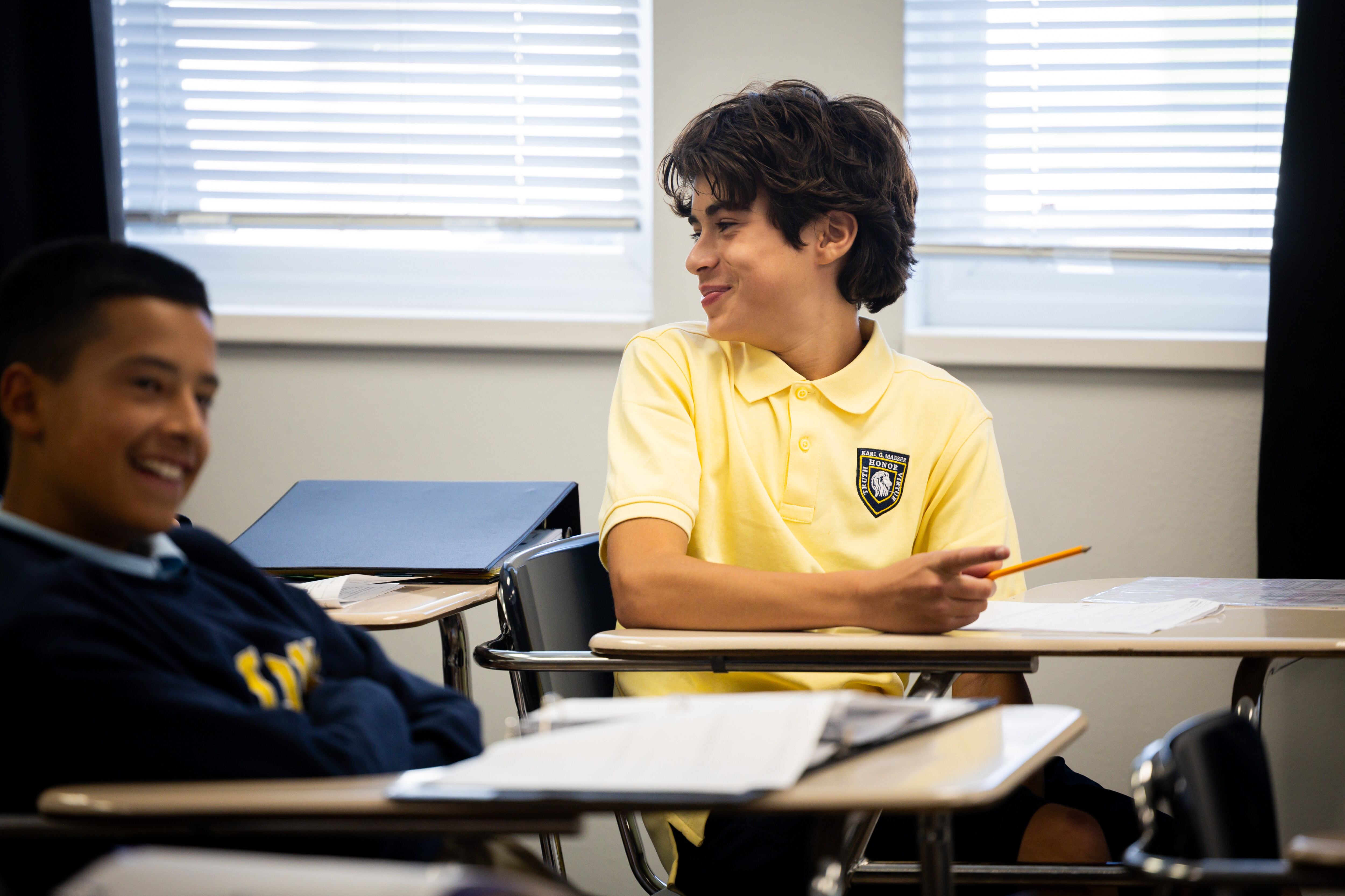 Ricco Oliveira, 14, smiles in a 8th grade history class at Karl Maeser Preparatory Academy in Lindon on Wednesday. Karl Maeser Preparatory Academy was selected as Utah's top high school.