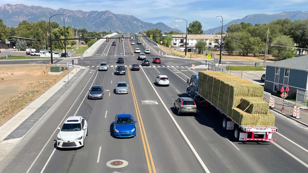The $238 million upgrade of 5600 South and the I-15 interchange in Roy is largely complete though other major road projects in the area continue. The photo shows 5600 South from a new pedestrian and bicycle overpass on Wednesday.