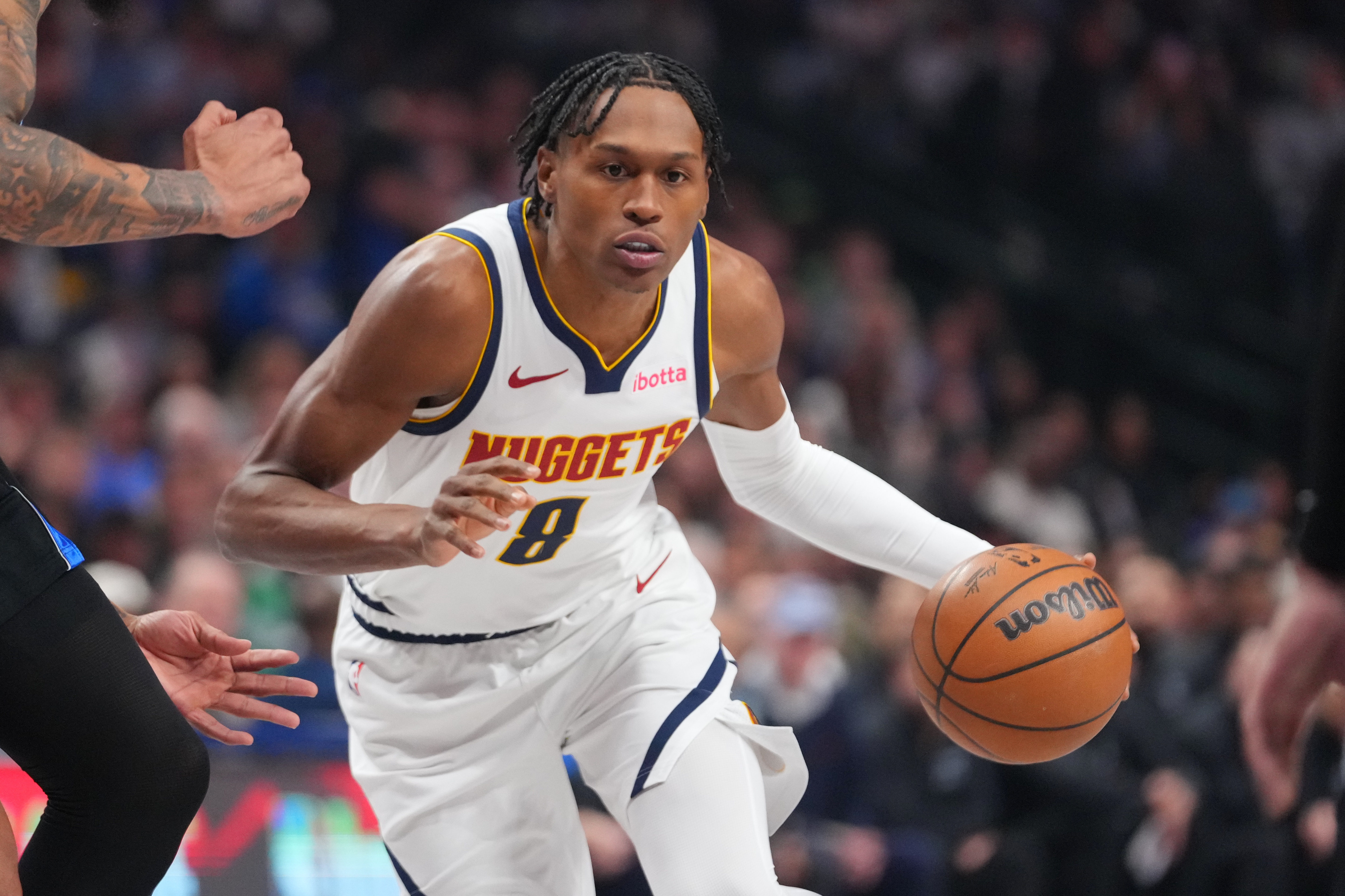 FILE - Denver Nuggets guard Peyton Watson (8) drives to the basket during the first half of an NBA basketball game between the Dallas Mavericks and the Denver Nuggets, on Jan. 14, 2026, in Dallas. 