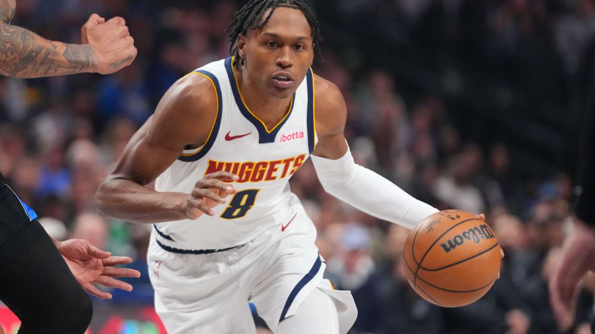 FILE - Denver Nuggets guard Peyton Watson (8) drives to the basket during the first half of an NBA basketball game between the Dallas Mavericks and the Denver Nuggets, on Jan. 14, 2026, in Dallas.