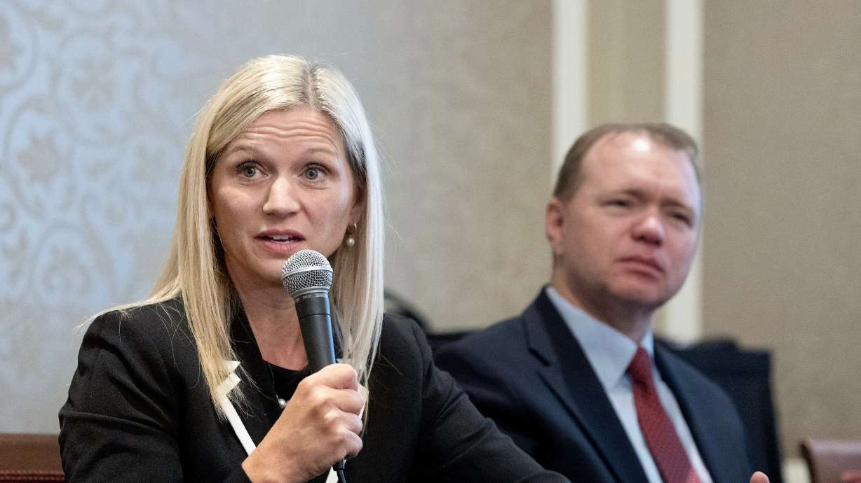 U.S. Attorney and former FTC Commissioner Melissa Holyoak and professor Aaron Nielson speak at the Alta Club in Salt Lake City on Wednesday. Holyoak spoke about the risk of expanding presidential powers.