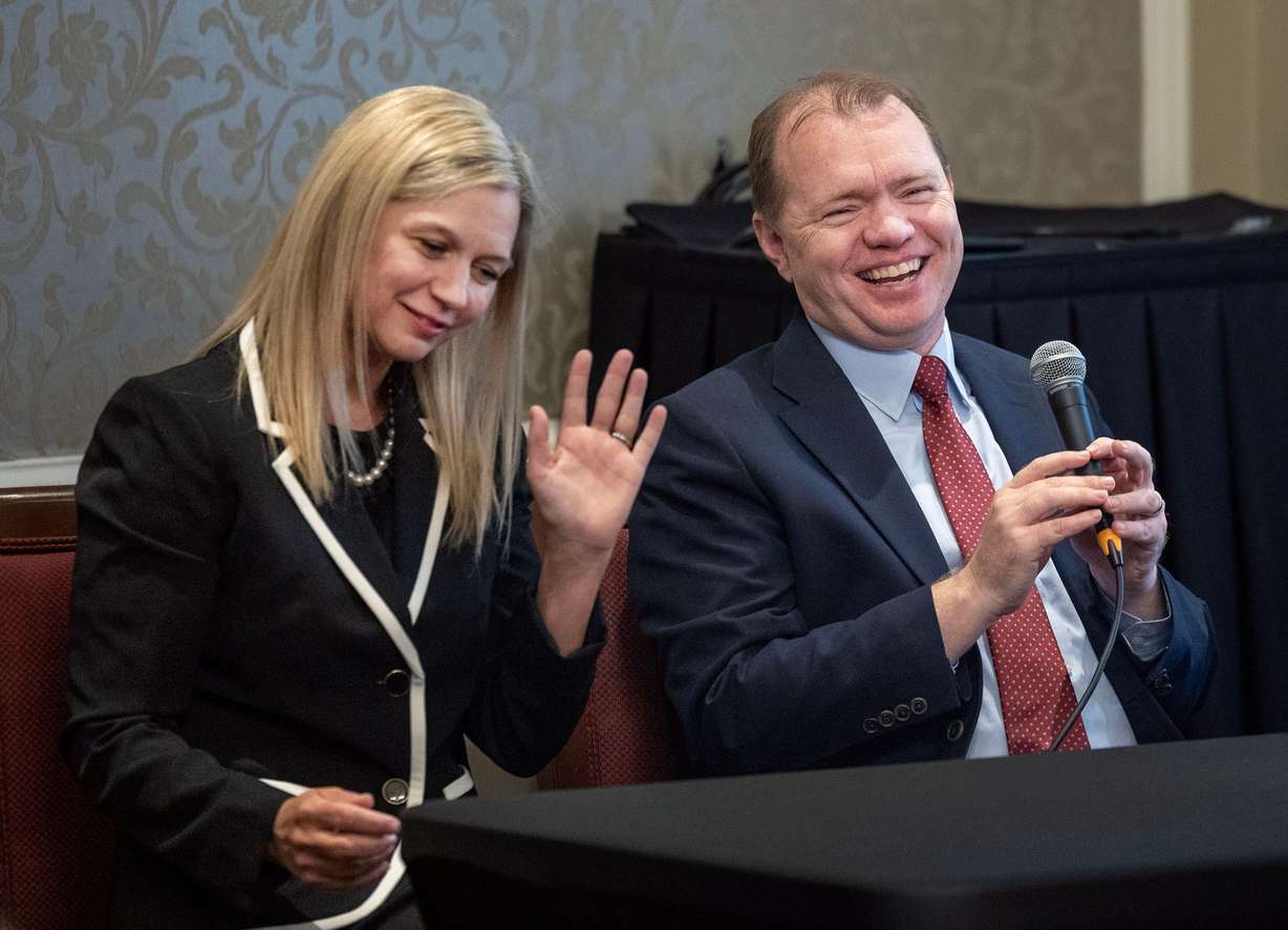 U.S. Attorney and former FTC Commissioner Melissa Holyoak and Aaron Nielson laugh while speaking at the Alta Club in Salt Lake City on Wednesday. Holyoak and Nielson spoke about the future of the FTC and the risks of expanding presidential powers.