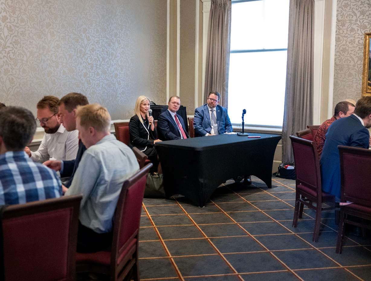 Former FTC Commissioner Melissa Holyoak, Aaron Nielson and Isaac Workman, senior vice president of communications and national programs for The Federalist Society, speak at the Alta Club in Salt Lake City on Wednesday. Holyoak and Nielson spoke about the future of the FTC and the risks of expanding presidential powers.