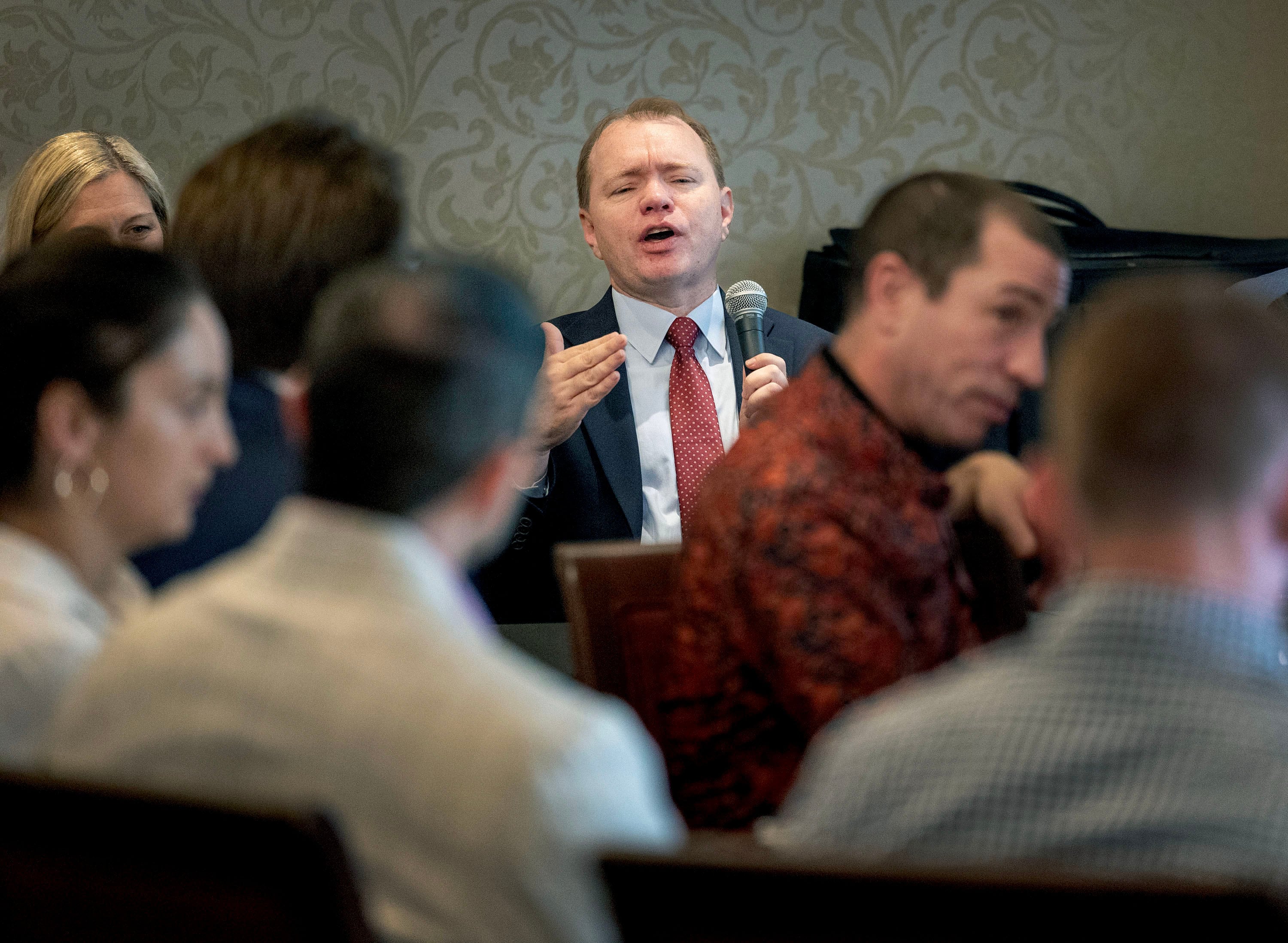 Professor Aaron Nielson speaks at the Alta Club in Salt Lake City on Wednesday. Nielson spoke about the future of the FTC and the risks of expanding presidential powers.
