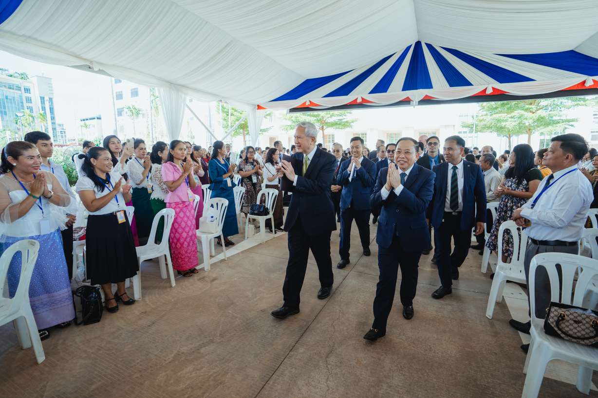 Elder Gerrit W. Gong of the Quorum of the Twelve Apostles of The Church of Jesus Christ of Latter-day Saints and His Excellency Minister of Cult and Religion Dr. Chay Borin, who was the guest of honor at the Phnom Penh Cambodia Temple open house celebration ceremony on August 12, give the traditional sampeah greeting to around 600 in attendance.