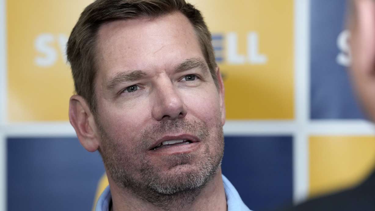 Then-Rep. Eric Swalwell, D-Calif., talks with reporters after holding a town hall meeting in Sacramento, Calif., April 7. Federal agents seized electronic devices from Swalwell's home, a source said on Thursday.